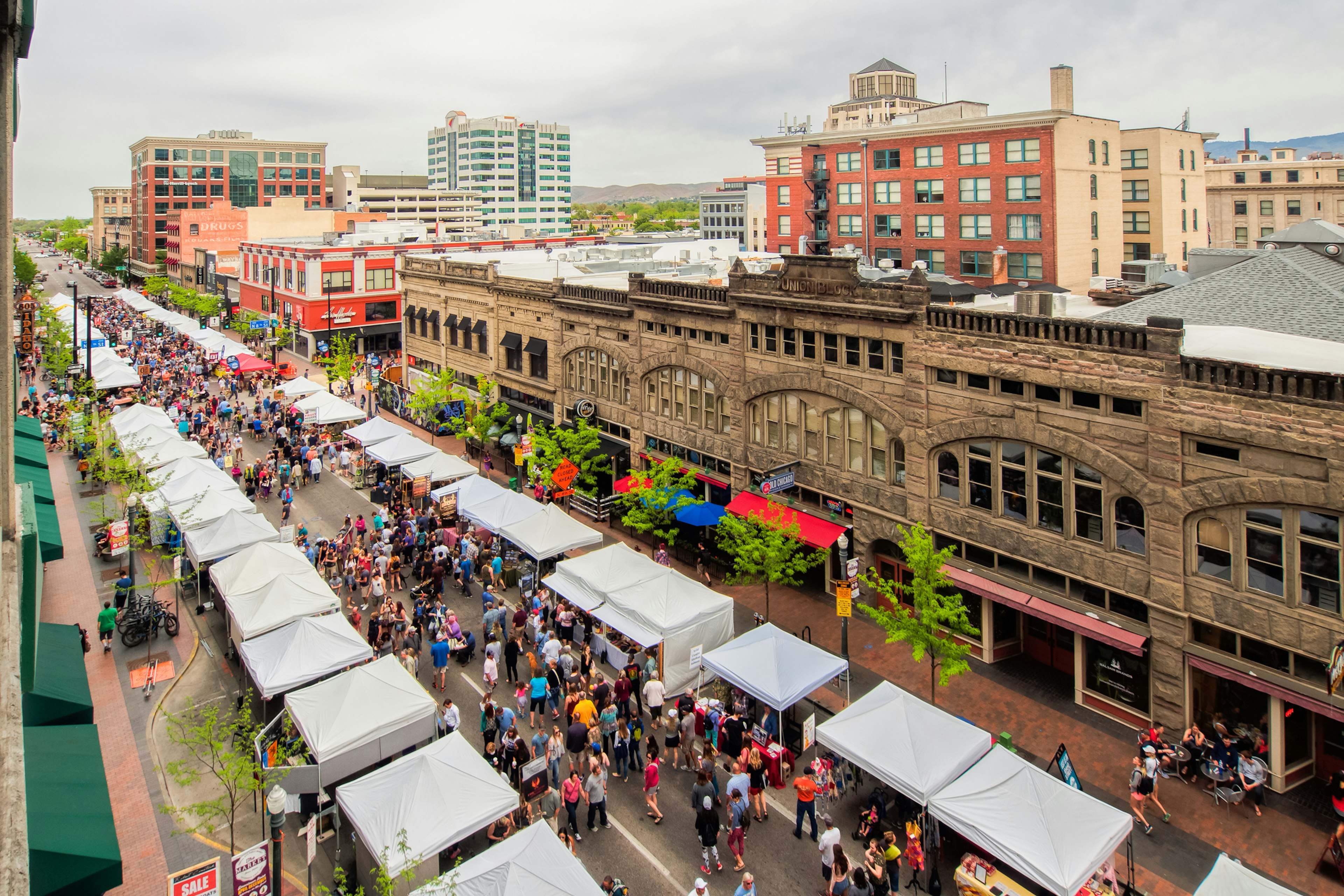 Bird's eye view of stalls and visitors along the street in the downtown area during Boise Farmers Market weekend in the late spring Getty Images