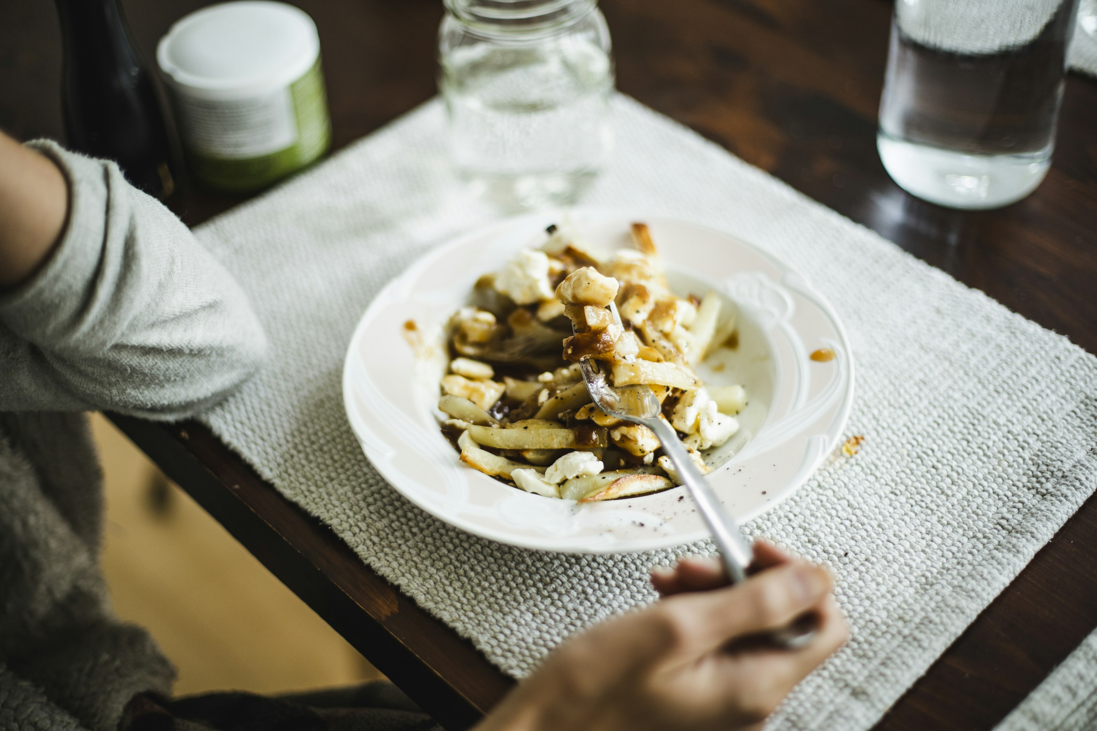 French fries with gravy sauce and cheese (Poutine)