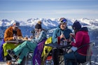 Skiers having drinks at the top during their ski  vacation in Whistler, Canada.