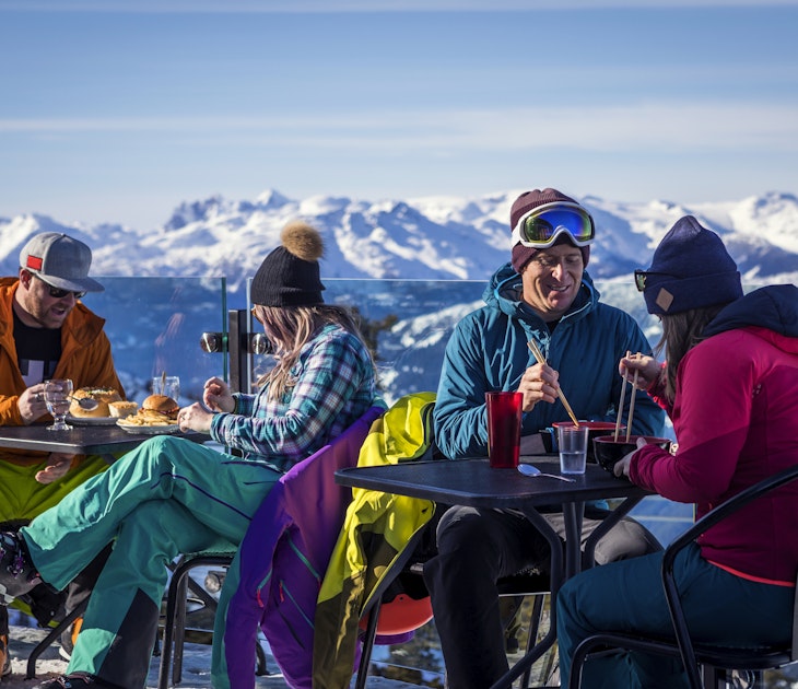 Skiers having drinks at the top during their ski  vacation in Whistler, Canada.