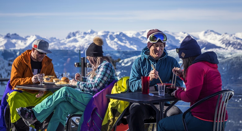 Skiers having drinks at the top during their ski  vacation in Whistler, Canada.