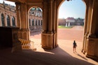 Young lady tourist walking in a yard among old building (Zwinger) in Dresden; Shutterstock ID 150448028; your: Sloane Tucker; gl: 65050; netsuite: Online Editorial; full: Dresden Things to Do Article