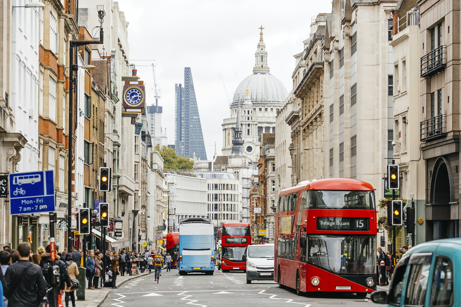 The busy streets of London with the dome of St. Paul's Cathedral in the background
