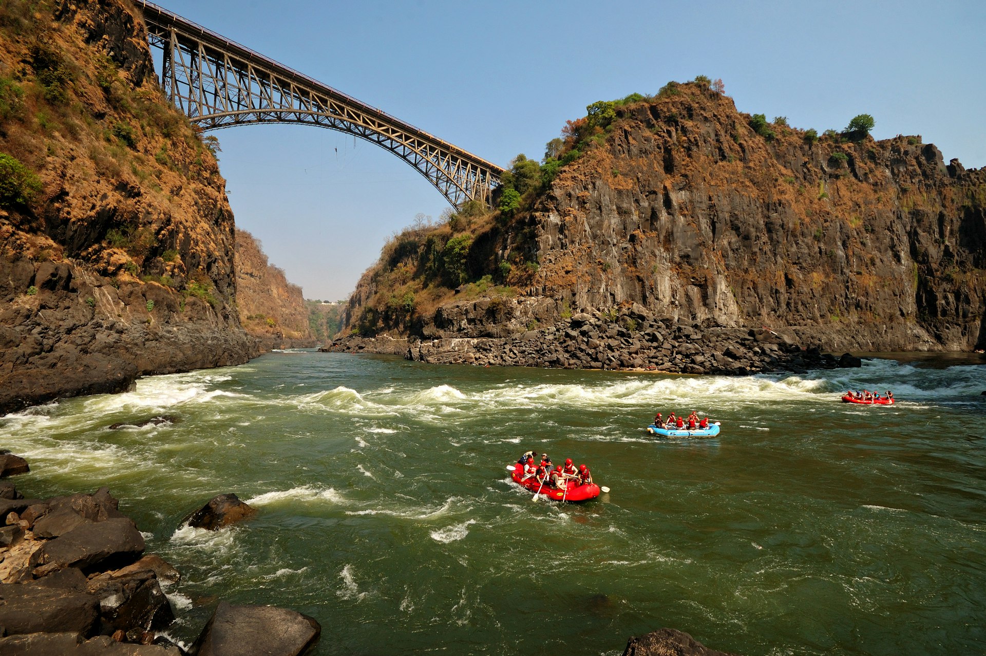 Rafters on the Zambezi River near Victoria Falls Bridge