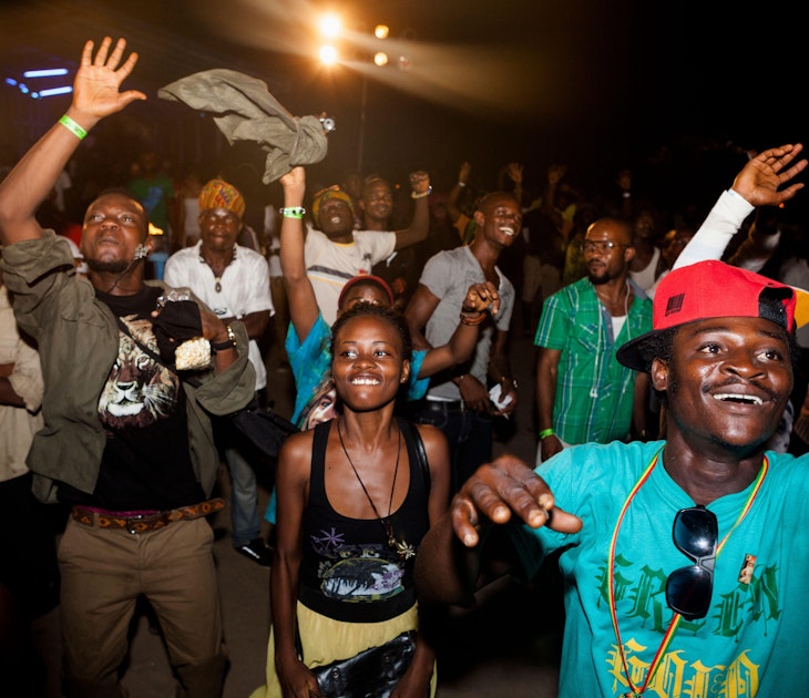 2BG2TXK Crowd dancing at a stage show on Labadi Beach, Accra, Ghana.