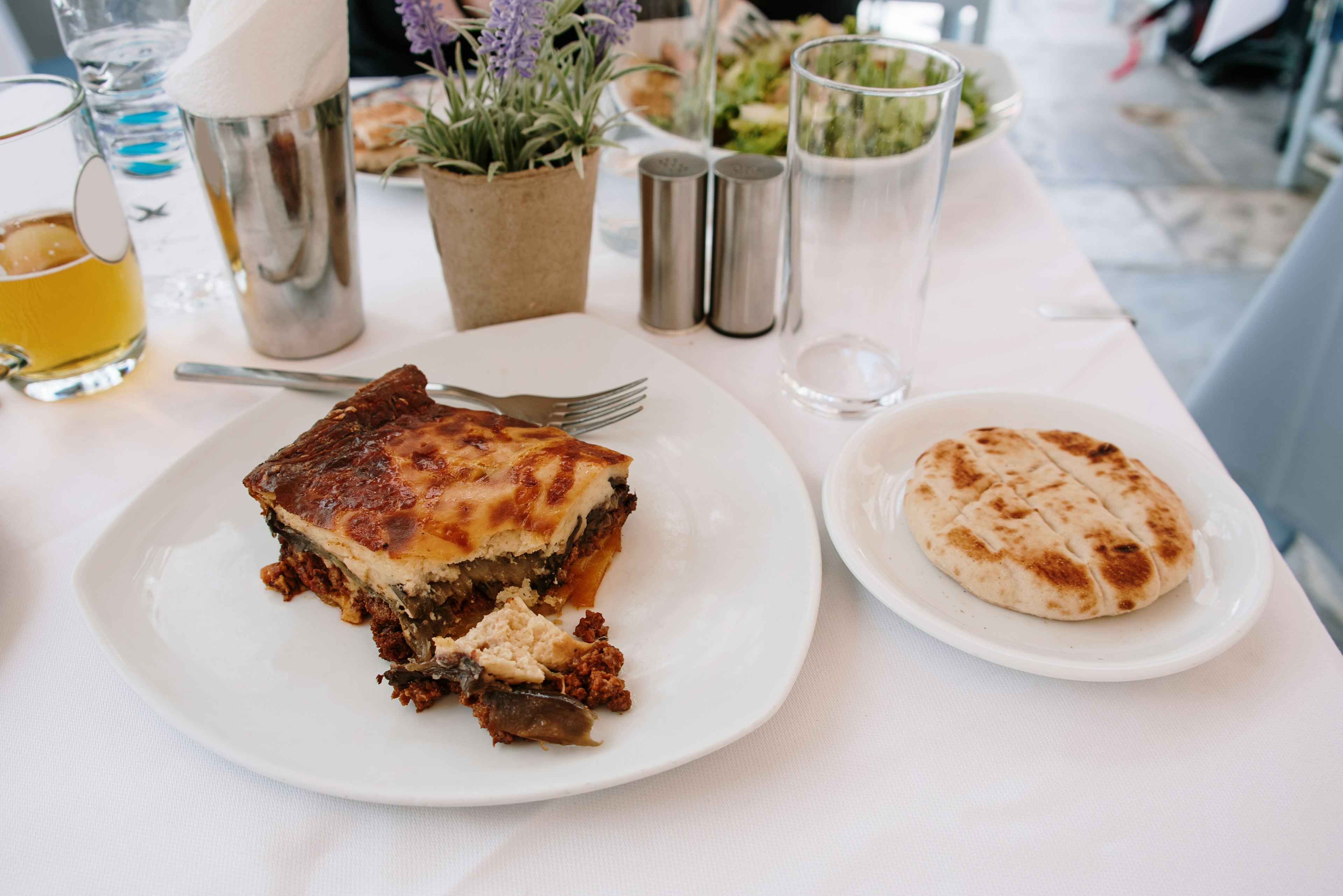 Moussaka on a table at an outdoor restaurant table in Athens, Greece