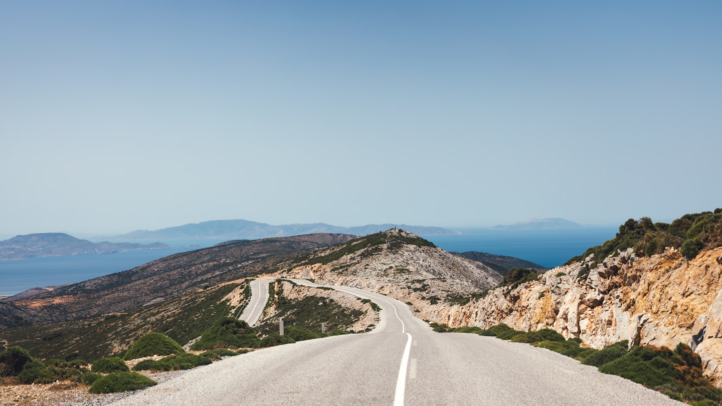 Idyllic Greek landscape with winding road, Naxos island, Greece.