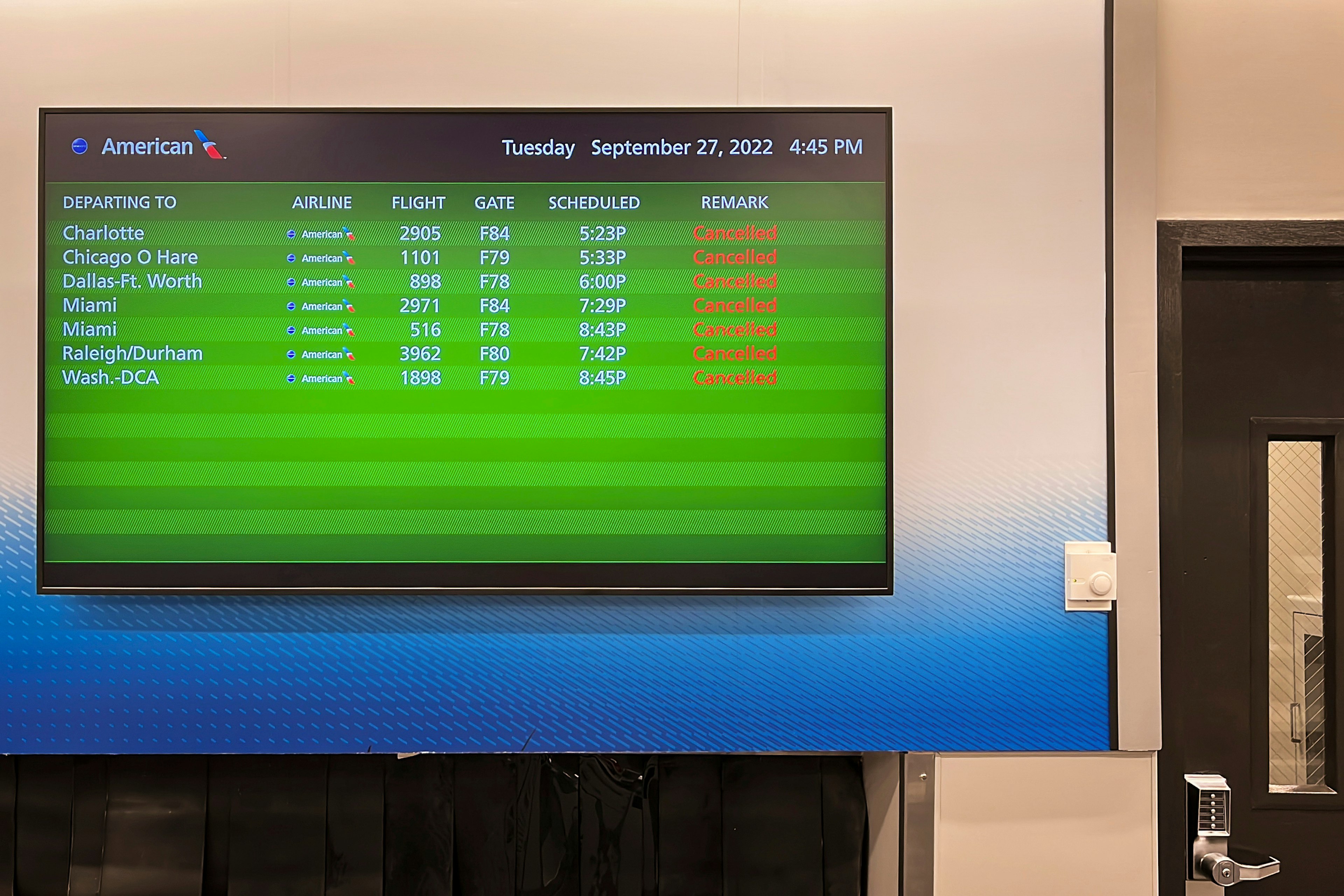 Flight information board displayed canceled flights due to Hurricane Ian