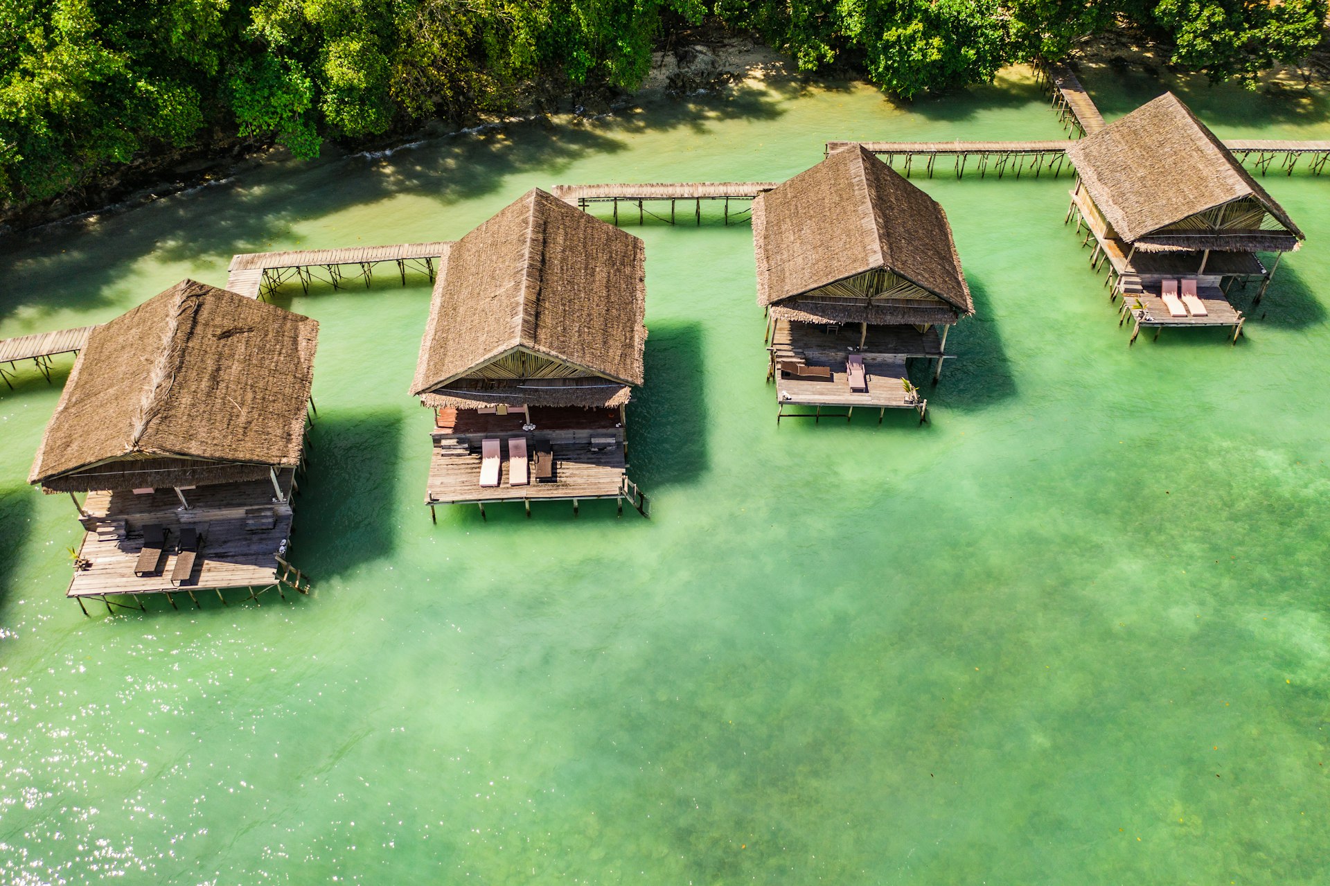 Overwater wooden bungalows in Raja Ampat
