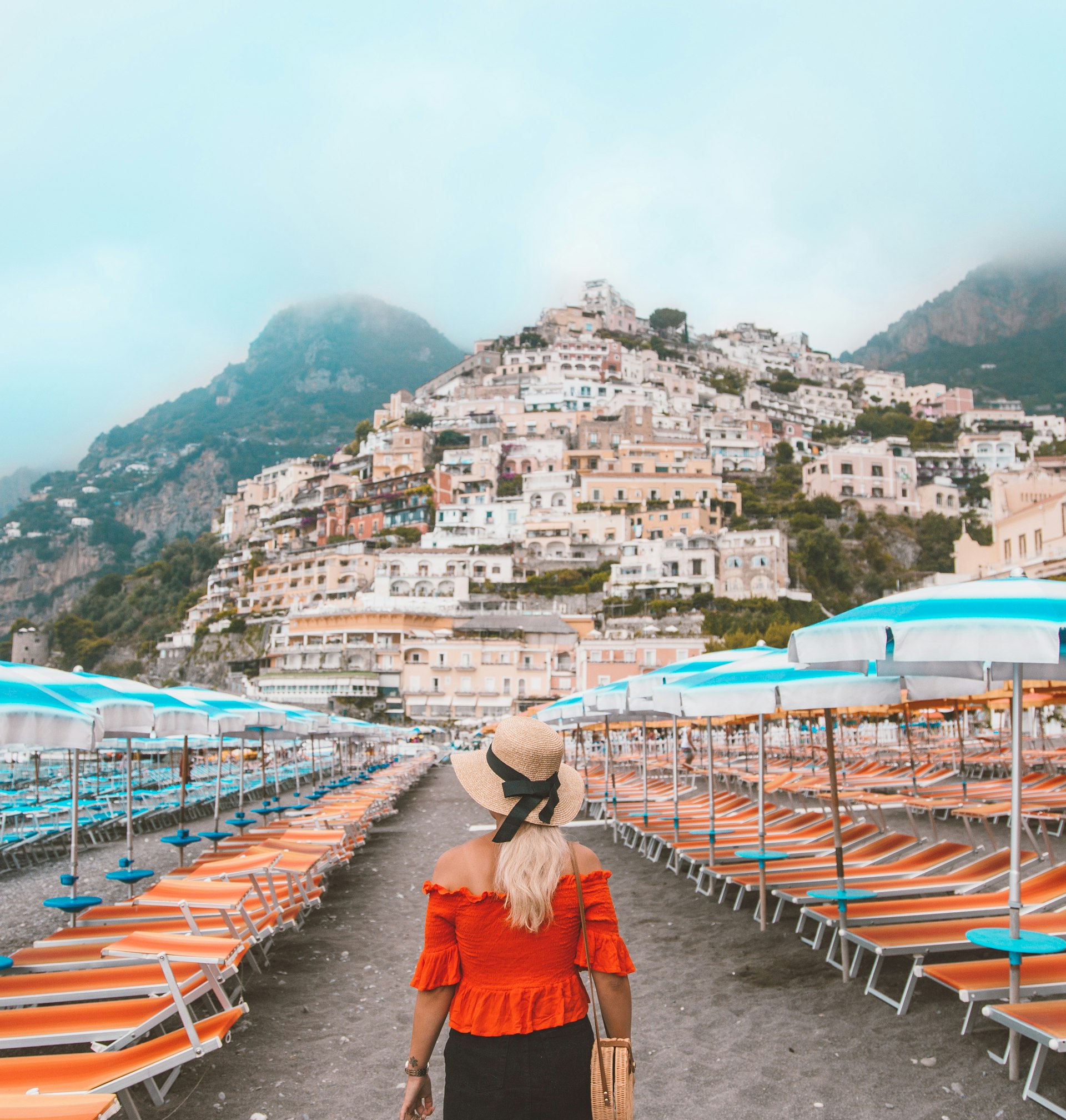 Young woman in front of Positano, Italy.