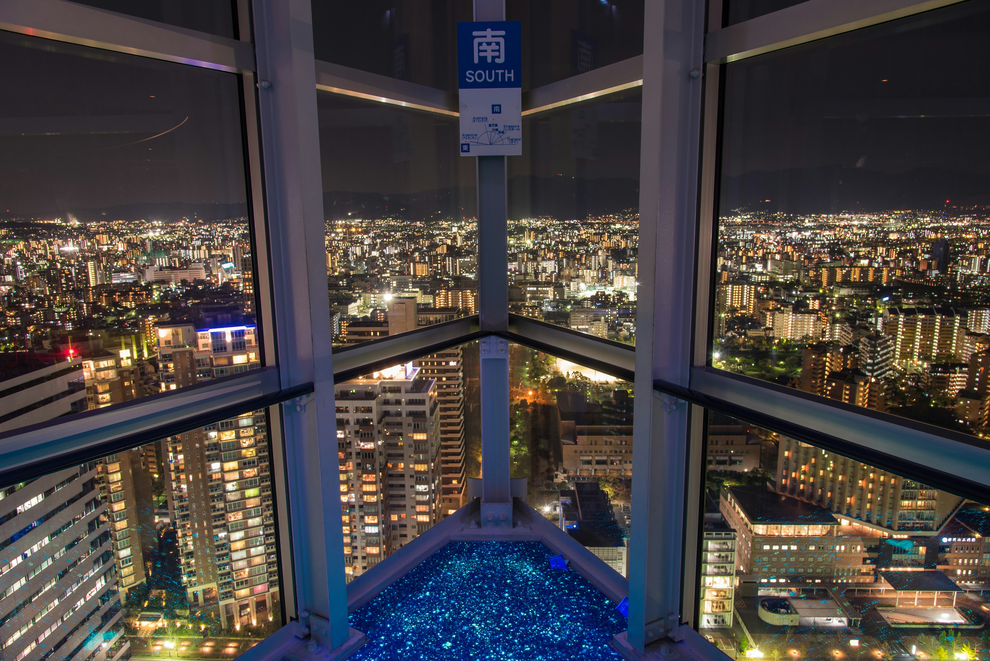 The Fukuoka skyline at night, viewed from inside the Fukuoka Tower