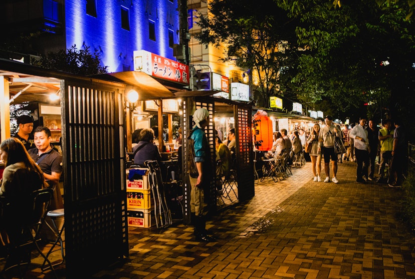 FUKUOKA, JAPAN - SEPTEMBER 26, 2016: People eating Yatai mobile food stall at night in Fukuoka, Kyushu, Japan; Shutterstock ID 709822984; your: Sloane Tucker; gl: 65050; netsuite: Online Editorial; full: Things to Do Fukuoka Article