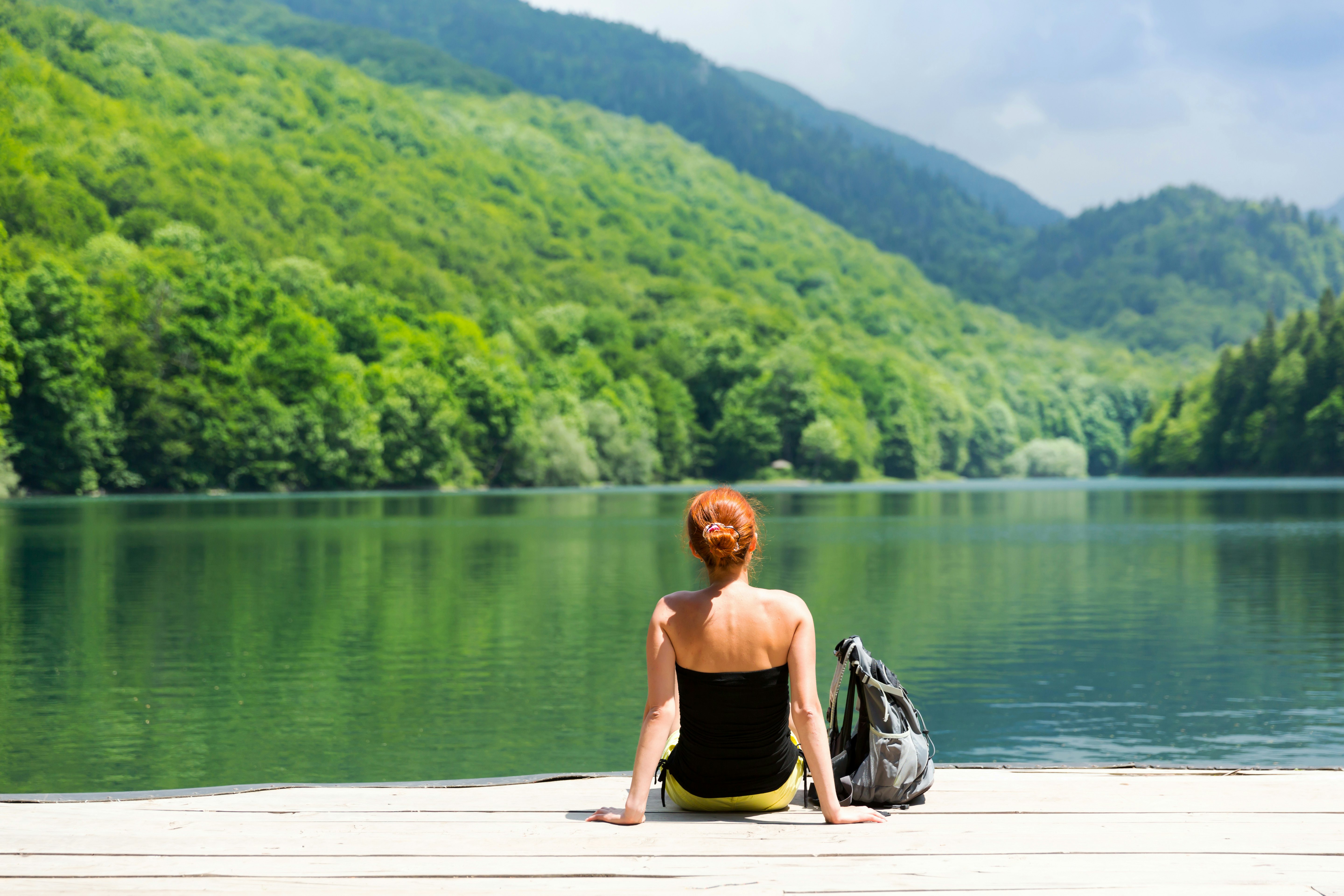 A women sitting on the shore of Lake Biograd