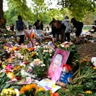 LONDON, ENGLAND - SEPTEMBER 13:  Members of the public visit the flowers in Green Park in memory of Queen Elizabeth II on September 13, 2022 in London, England. Elizabeth Alexandra Mary Windsor was born in Bruton Street, Mayfair, London on 21 April 1926. She married Prince Philip in 1947 and acceded to the throne of the United Kingdom and Commonwealth on 6 February 1952 after the death of her Father, King George VI. Queen Elizabeth II died at Balmoral Castle in Scotland on September 8, 2022, and is succeeded by her eldest son, King Charles III. (Photo by Shaun Botterill/Getty Images)