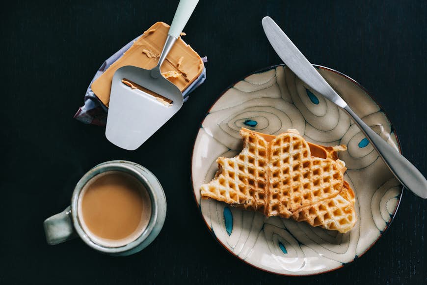 A traditional Norwegian breakfast: waffles, brown cheese and coffee
