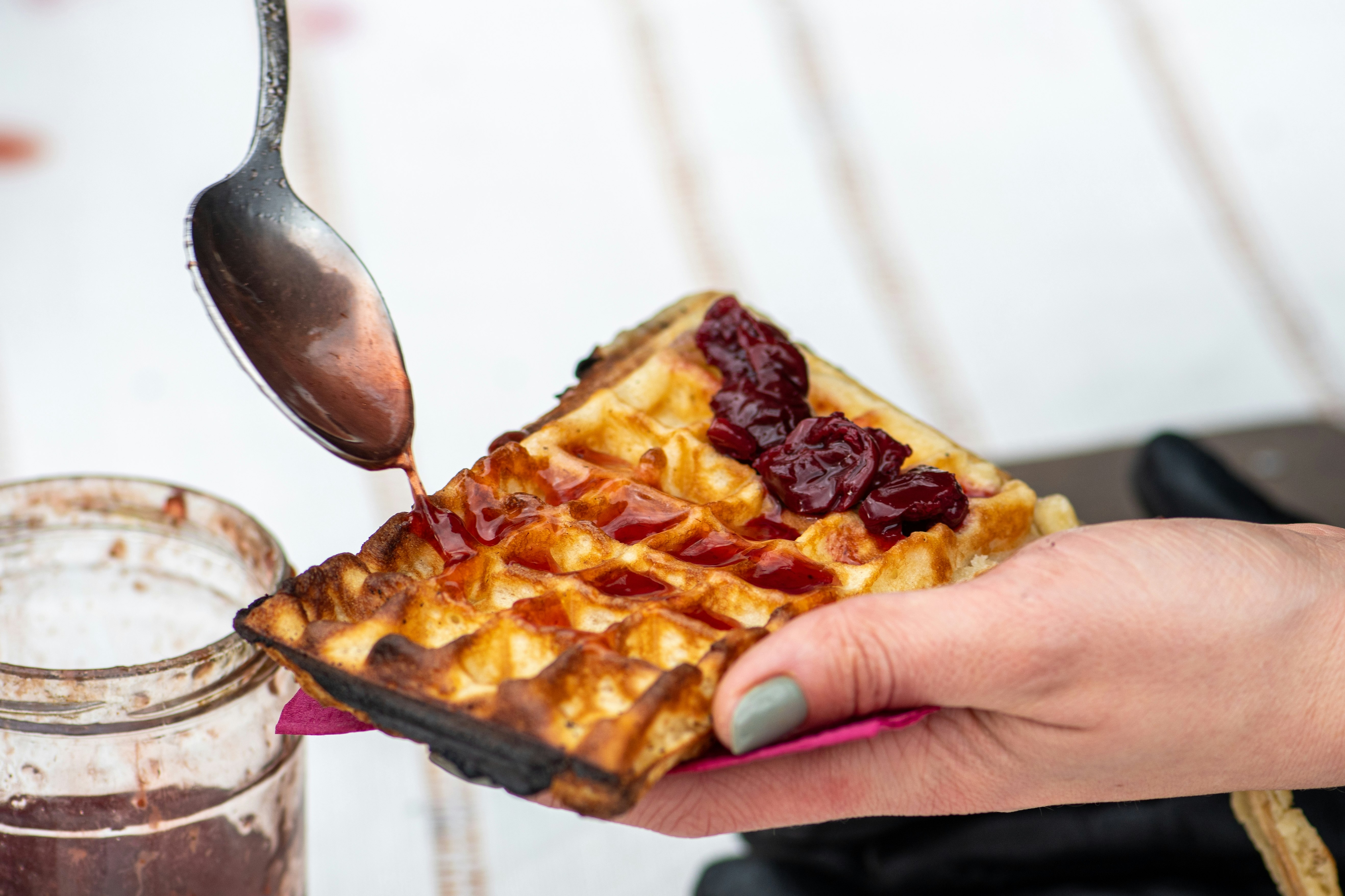 Preparing waffle or waffles with jam, dish made from leavened batter or dough that is cooked between two plates that are patterned to give a characteristic size, shape, and surface impression