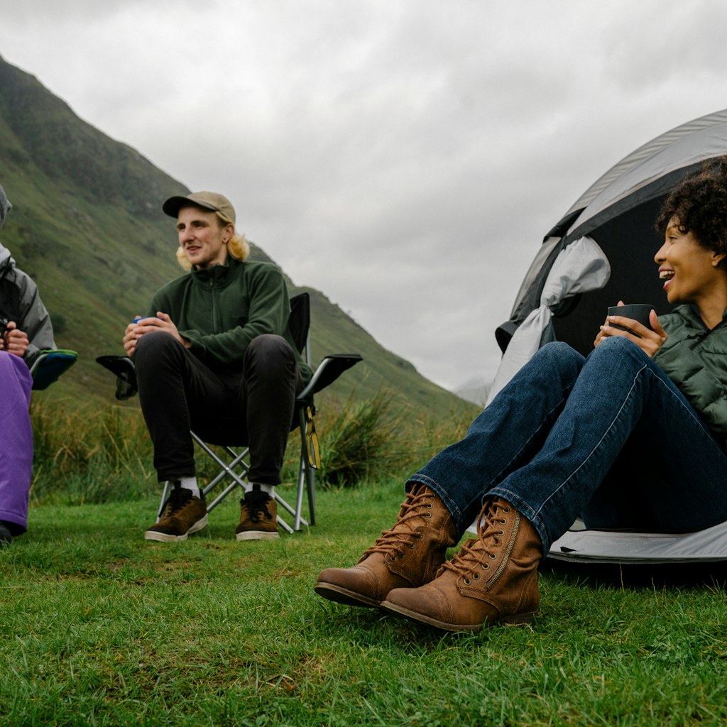 Group of campers in the Scottish Highlands; Shutterstock ID 1247570566; your: Sloane Tucker; gl: 65050 ; netsuite: Online Editorial; full: Scotland Things to Know Article