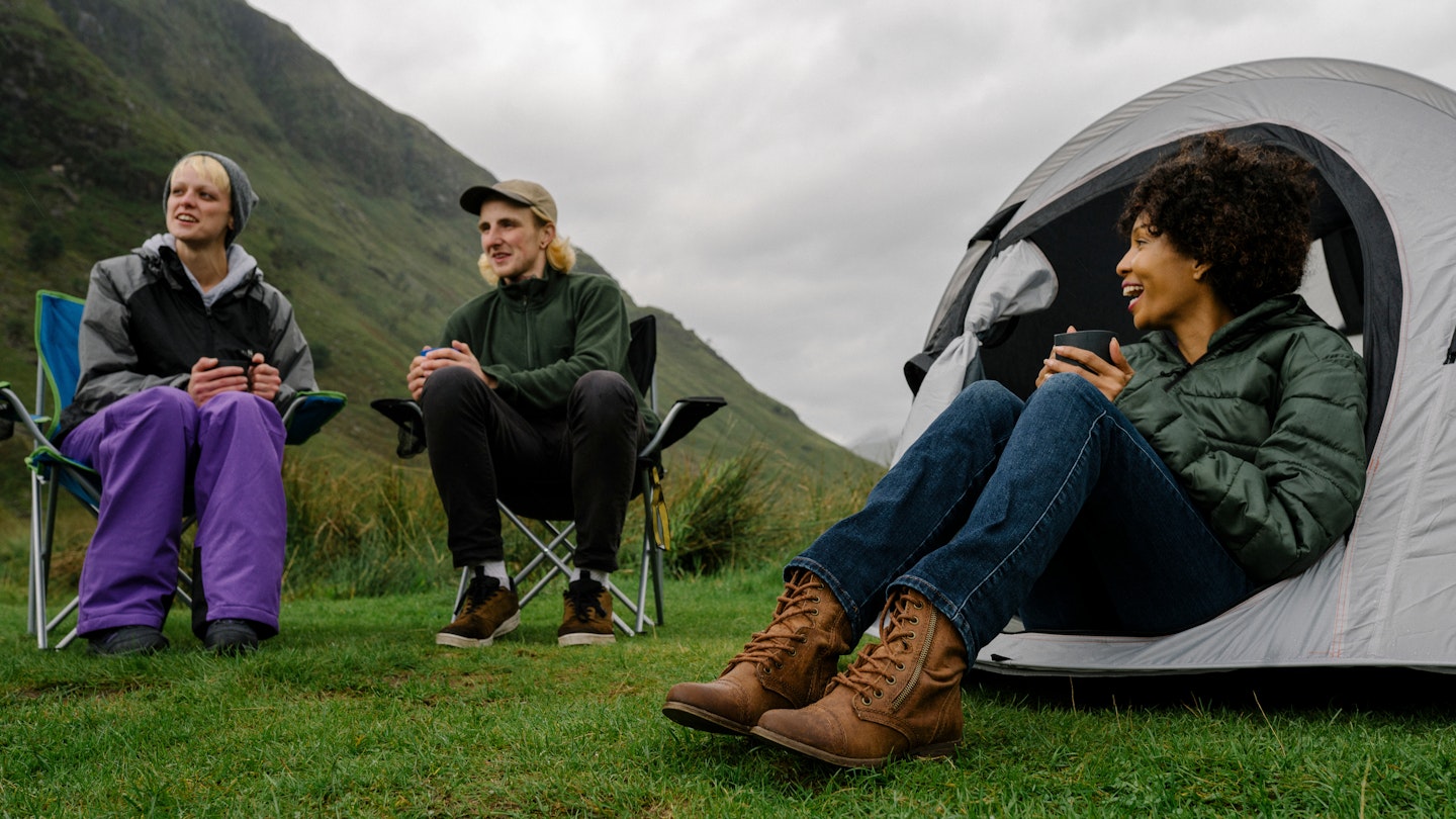 Group of campers in the Scottish Highlands; Shutterstock ID 1247570566; your: Sloane Tucker; gl: 65050 ; netsuite: Online Editorial; full: Scotland Things to Know Article