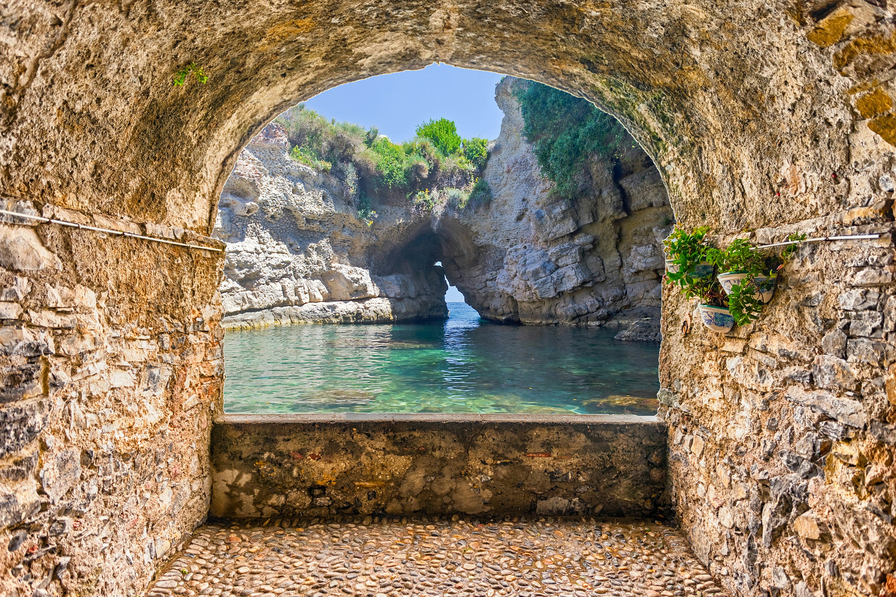 Rock balcony overlooking a natural pool in Sorrento, Naples, Italy