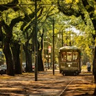 New Orleans, Louisiana - June 18, 2019: Passengers ride the historic railway streetcar along Saint Charles Avenue in the Garden District of New Orleans Louisiana USA.
