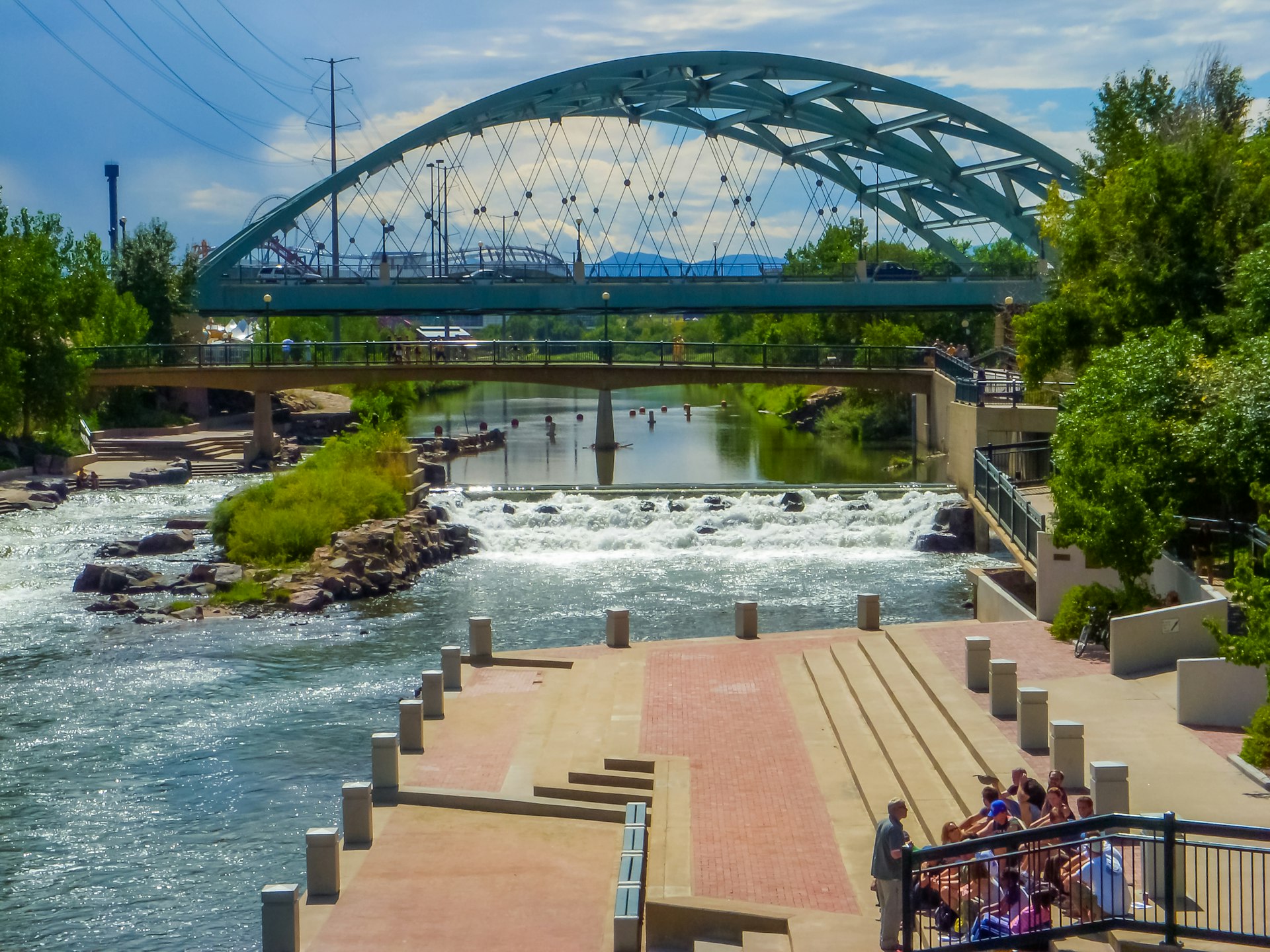 Visitors enjoy the views of Confluence Park in the heart of Denver, Colorado