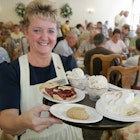 AFNJKY Indiana,LaGrange County,Shipshewana,The Blue Gate Restaurant & Bakery,Amish dining,waitress server employee interior,dessert,pie,ice cream,IN070829071
