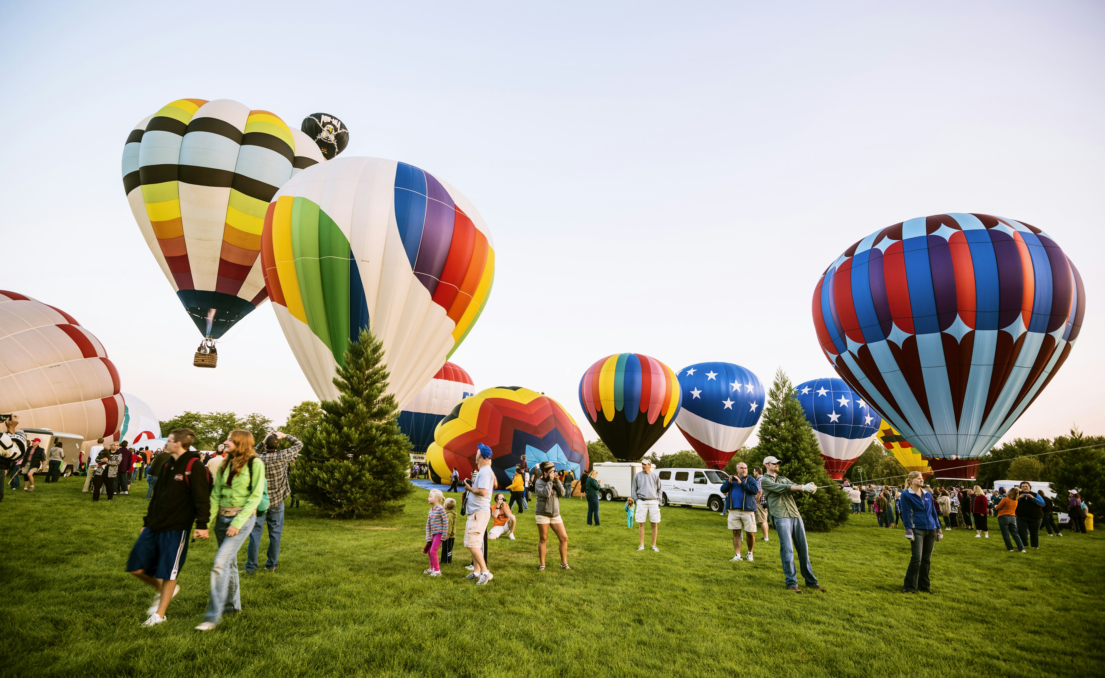 Spirit of Boise Balloon Classic being held at Ann Morrison Park in Boise and people enjoying hot air balloons launch