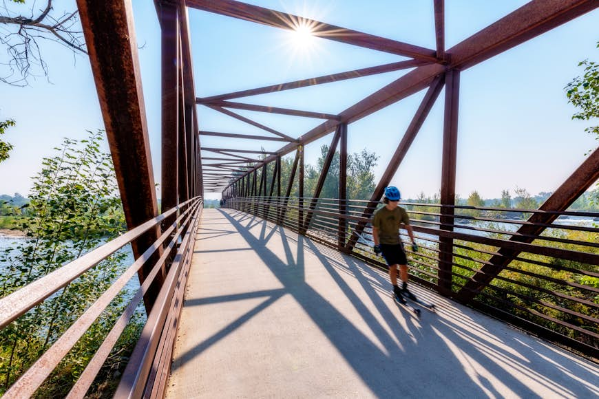 Boise river bridge with a skater on the move