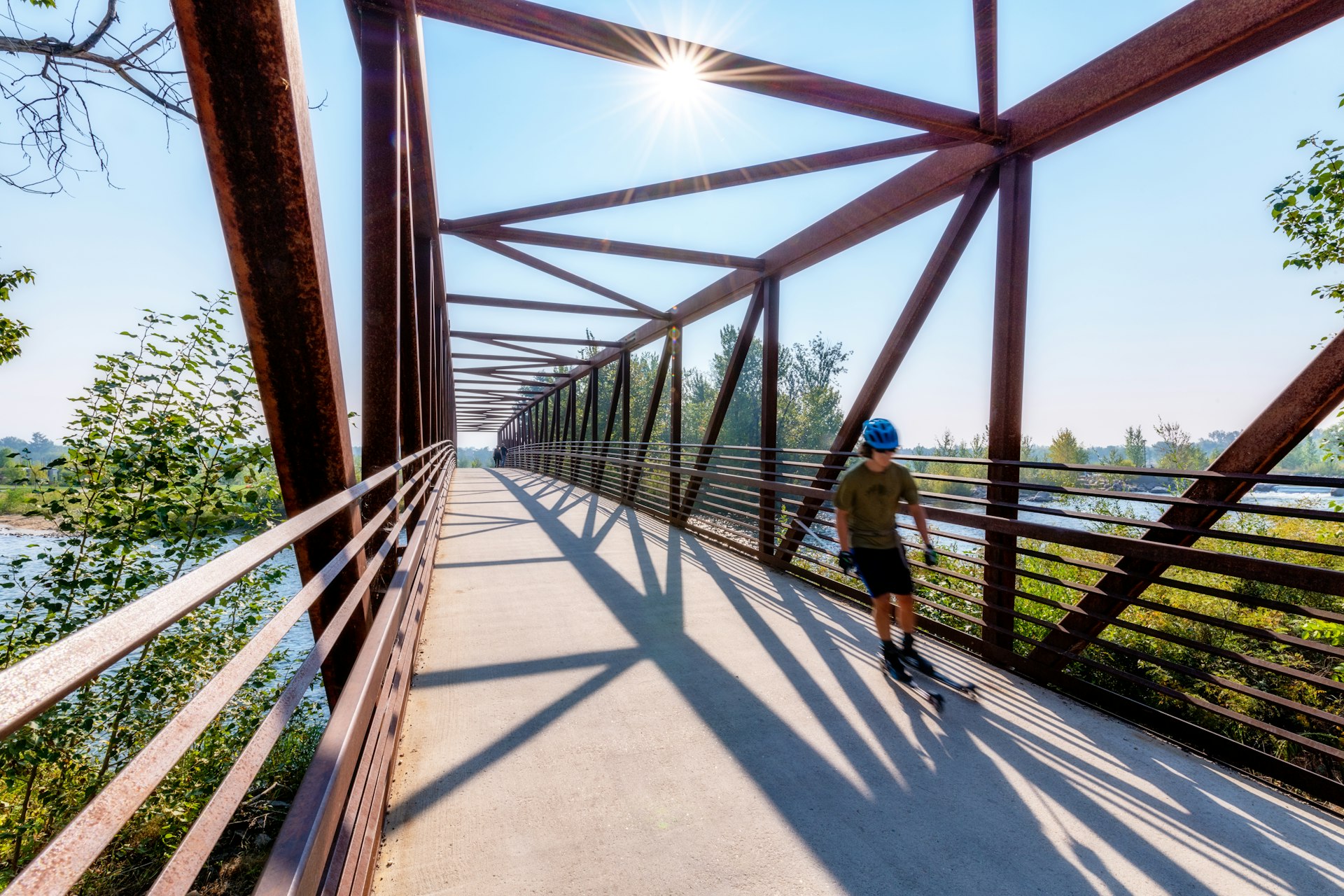 Boise river bridge with a skater on the move