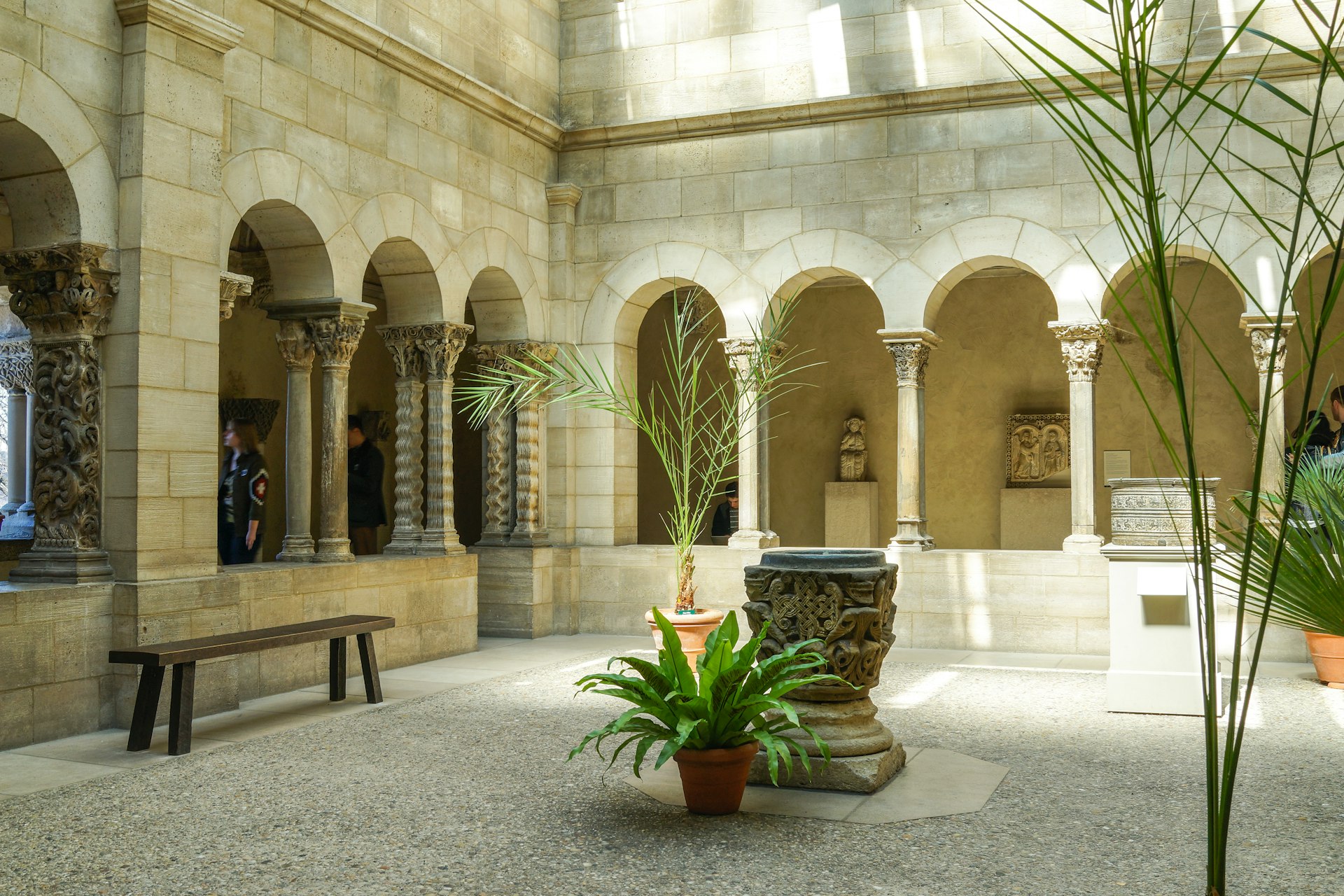 A small courtyard lined with a columned passageway