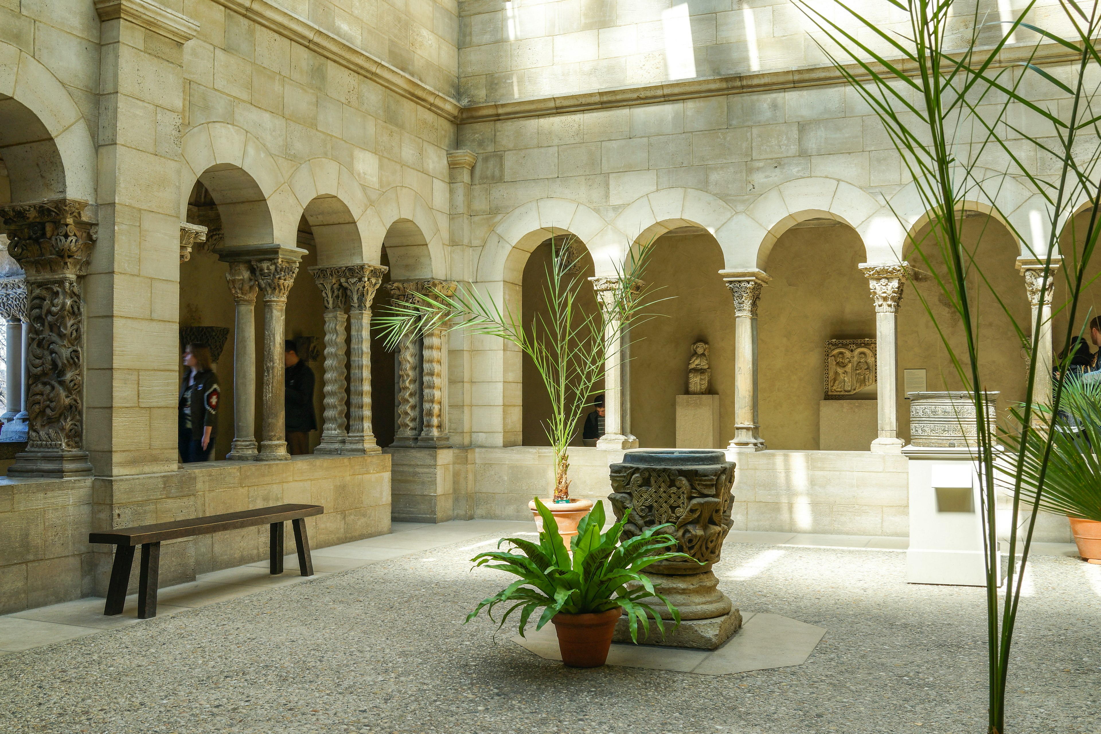 A small courtyard lined with a columned passageway