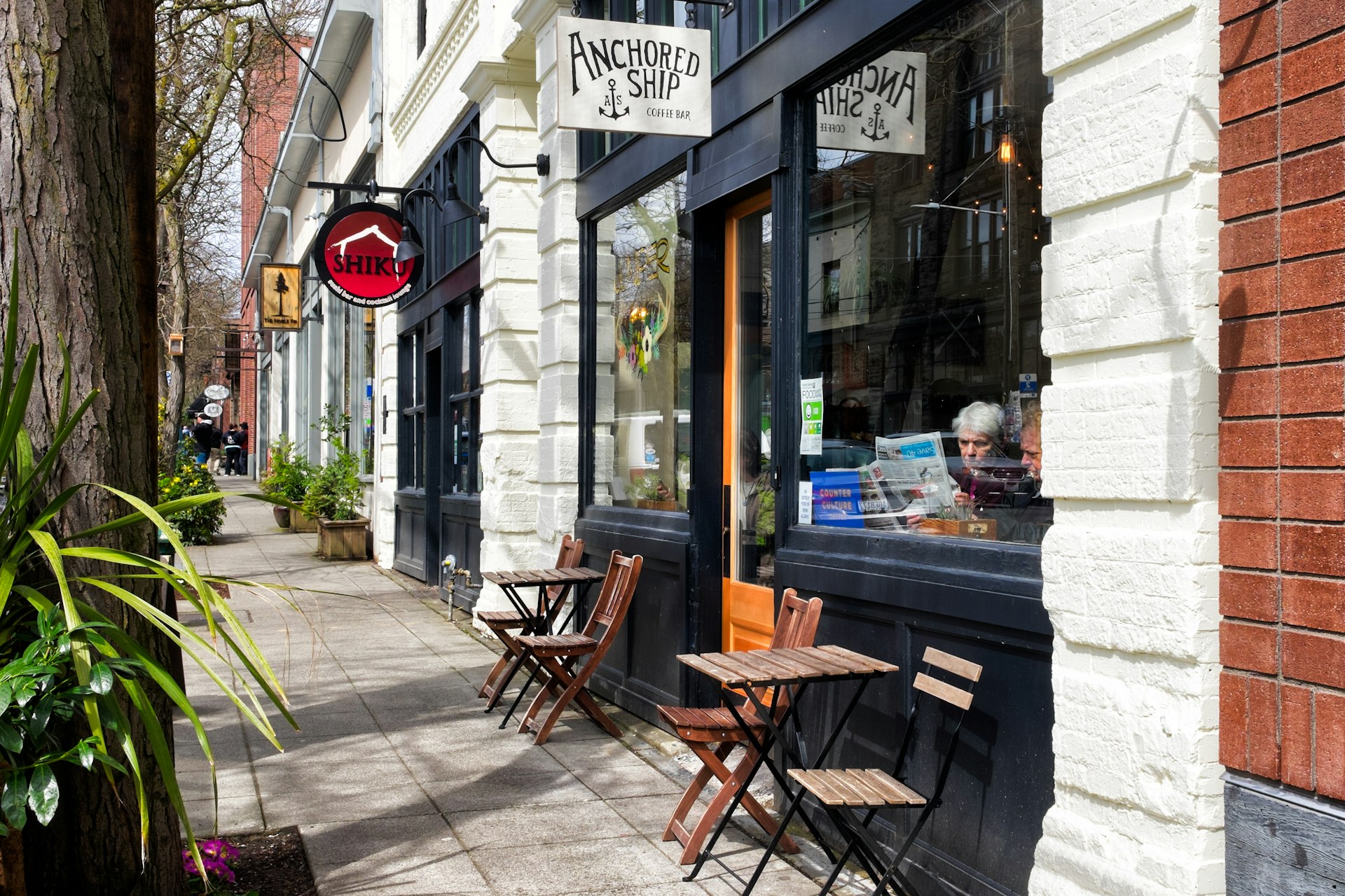 Exterior of a cafe with tables outside in the Ballard neighborhood of Seattle, Washington