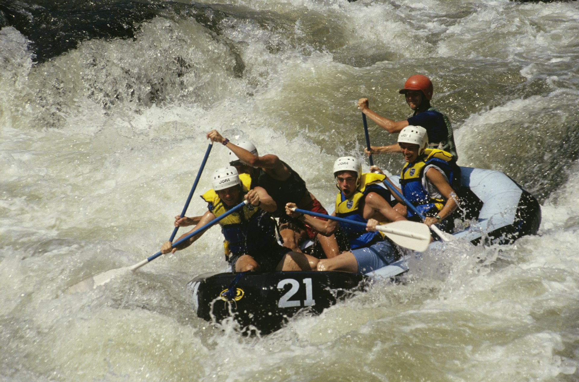 A group of people whitewater rafting on the Chattooga River