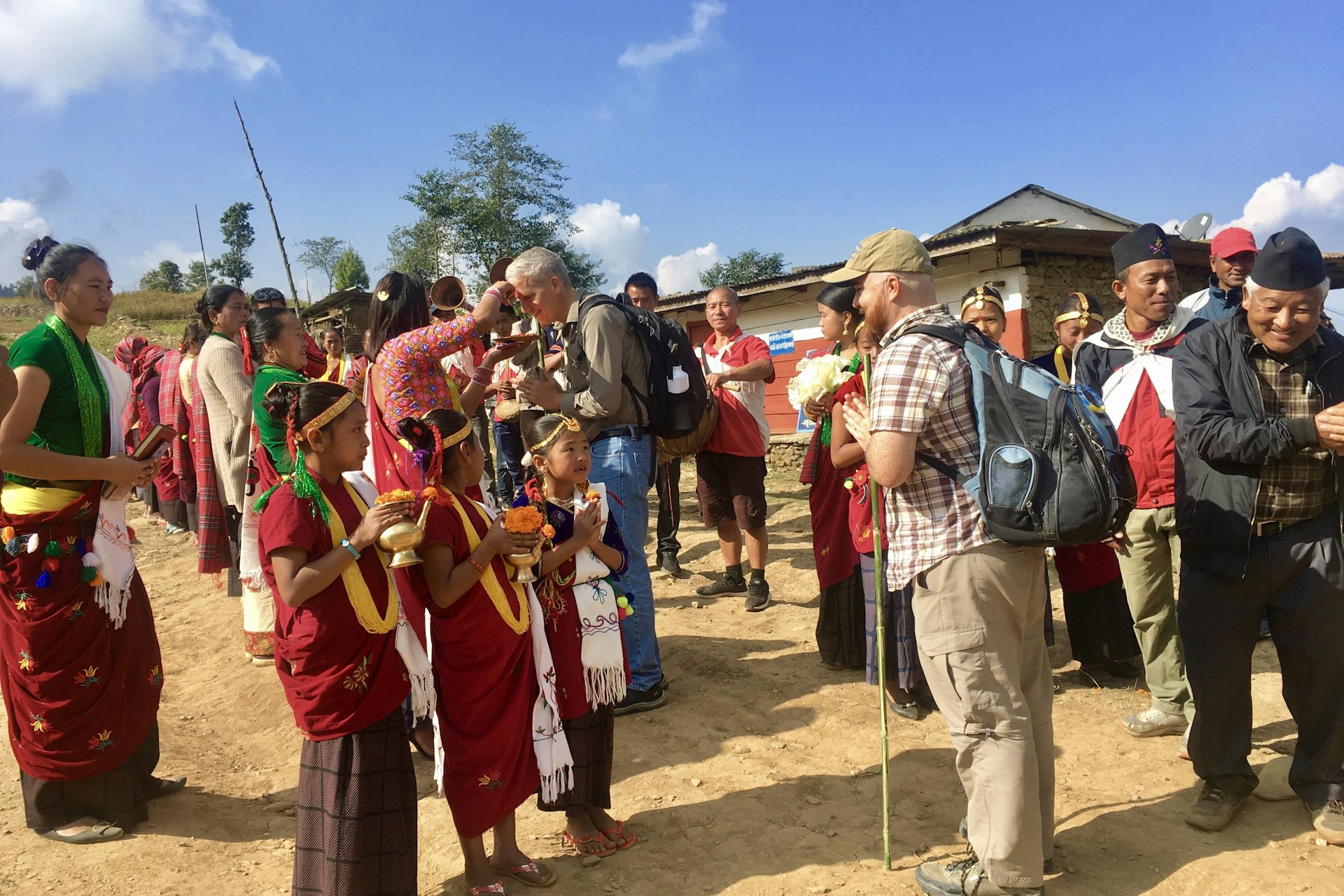 Tourists meeting villagers in a rural community in Nepal