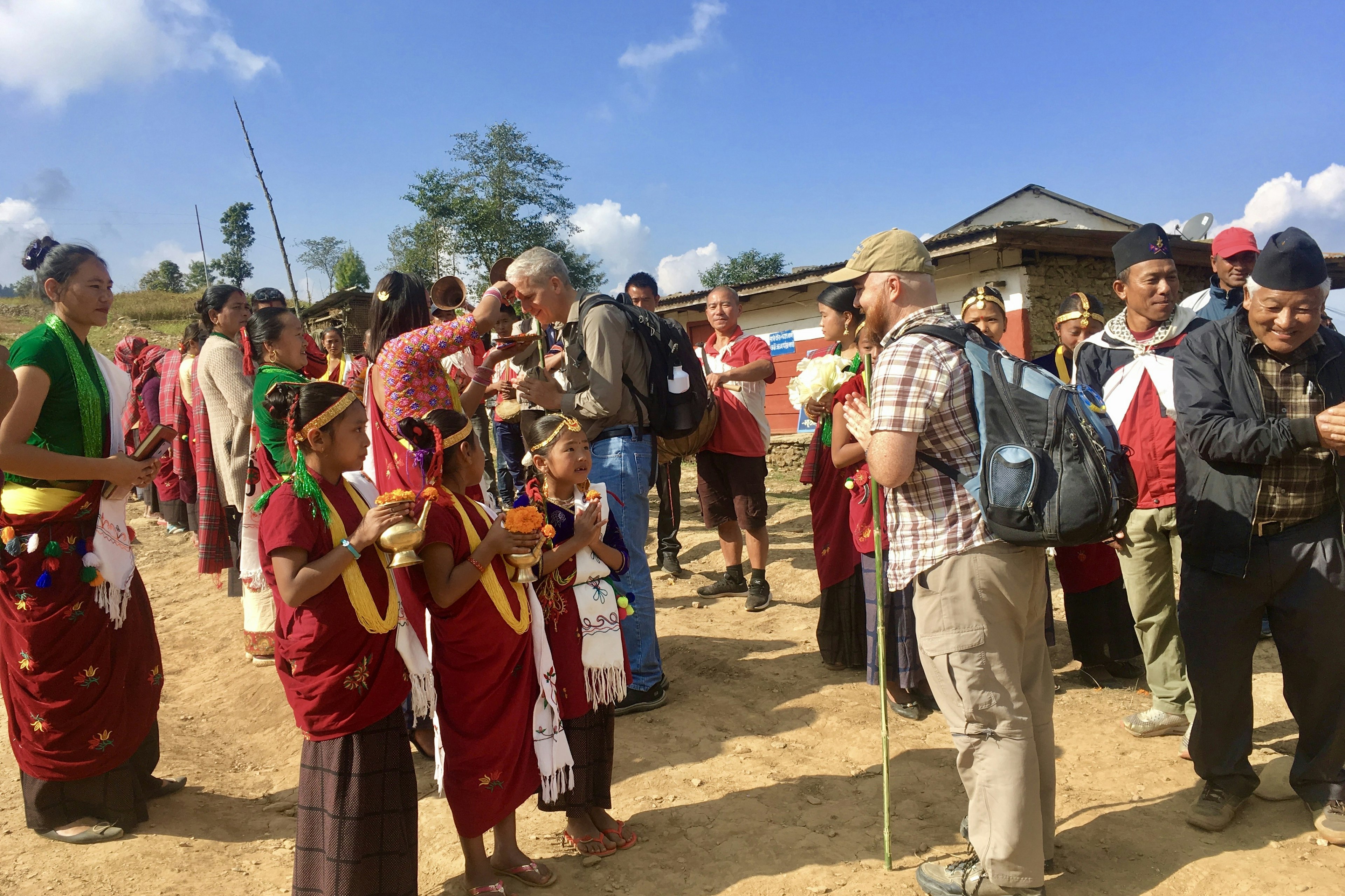 Tourists meeting villagers in a rural community in Nepal