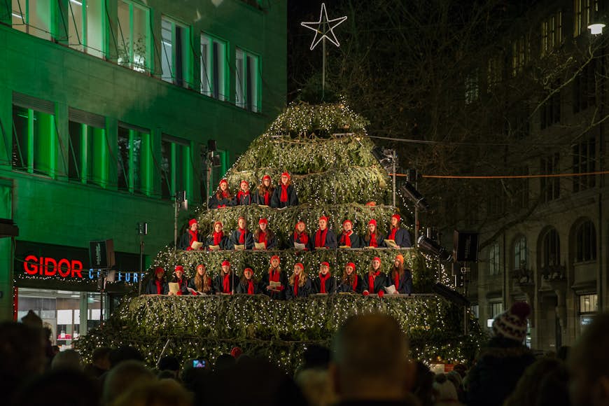 Singing christmas tree during christmas time, Werdmühleplatz, Zürich, Switzerland.