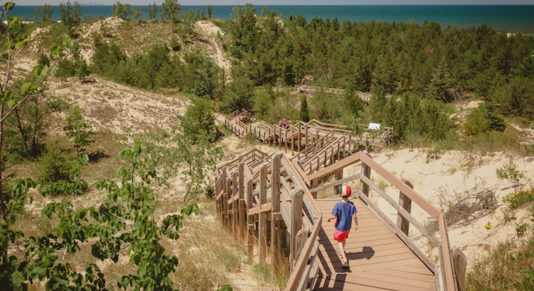 Boy hiking along dune succession trail in Indiana Dunes National Park