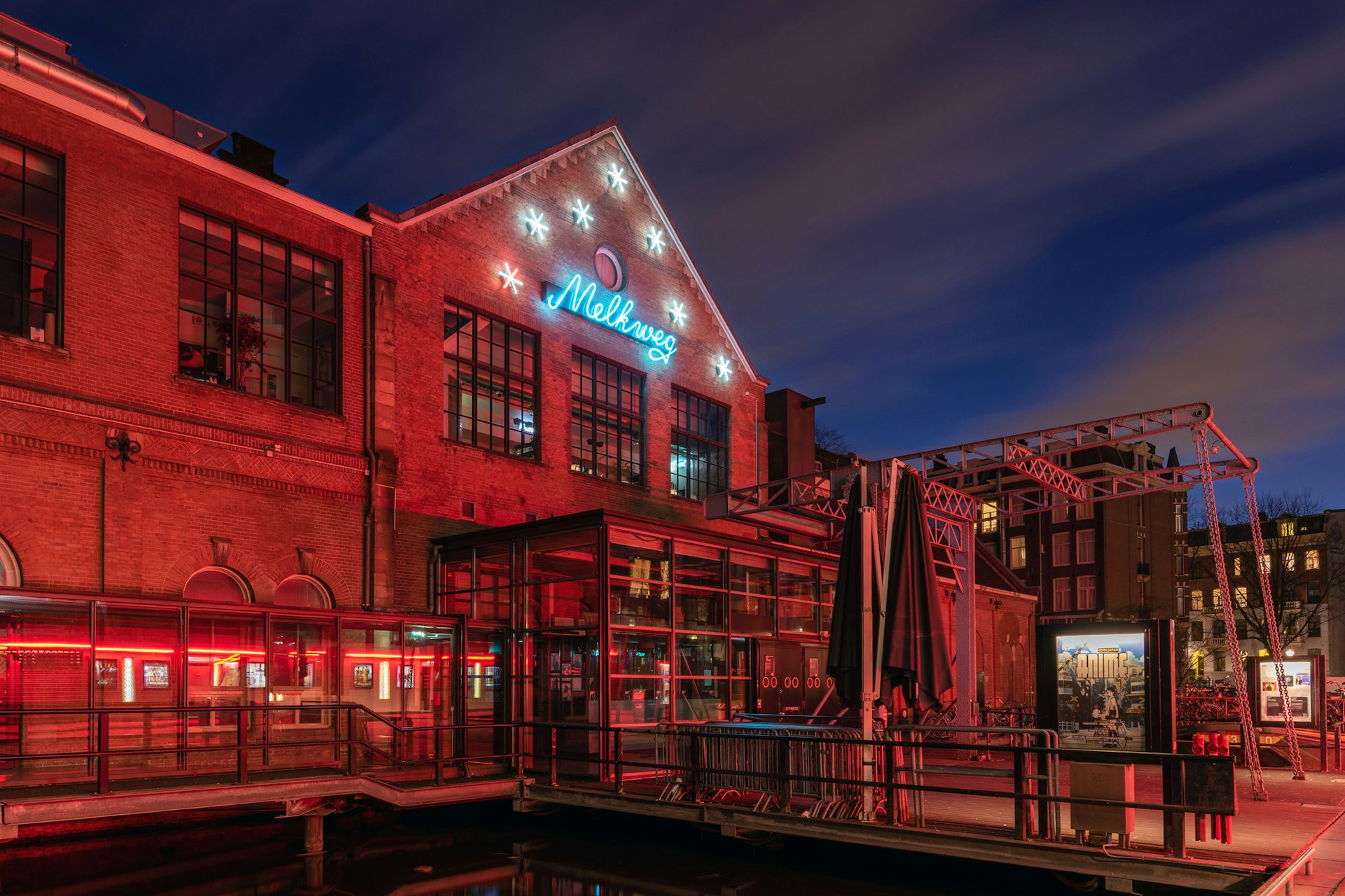 This is a picture of the Melkweg (meaning milkyway) music hall in the center of Amsterdam at night