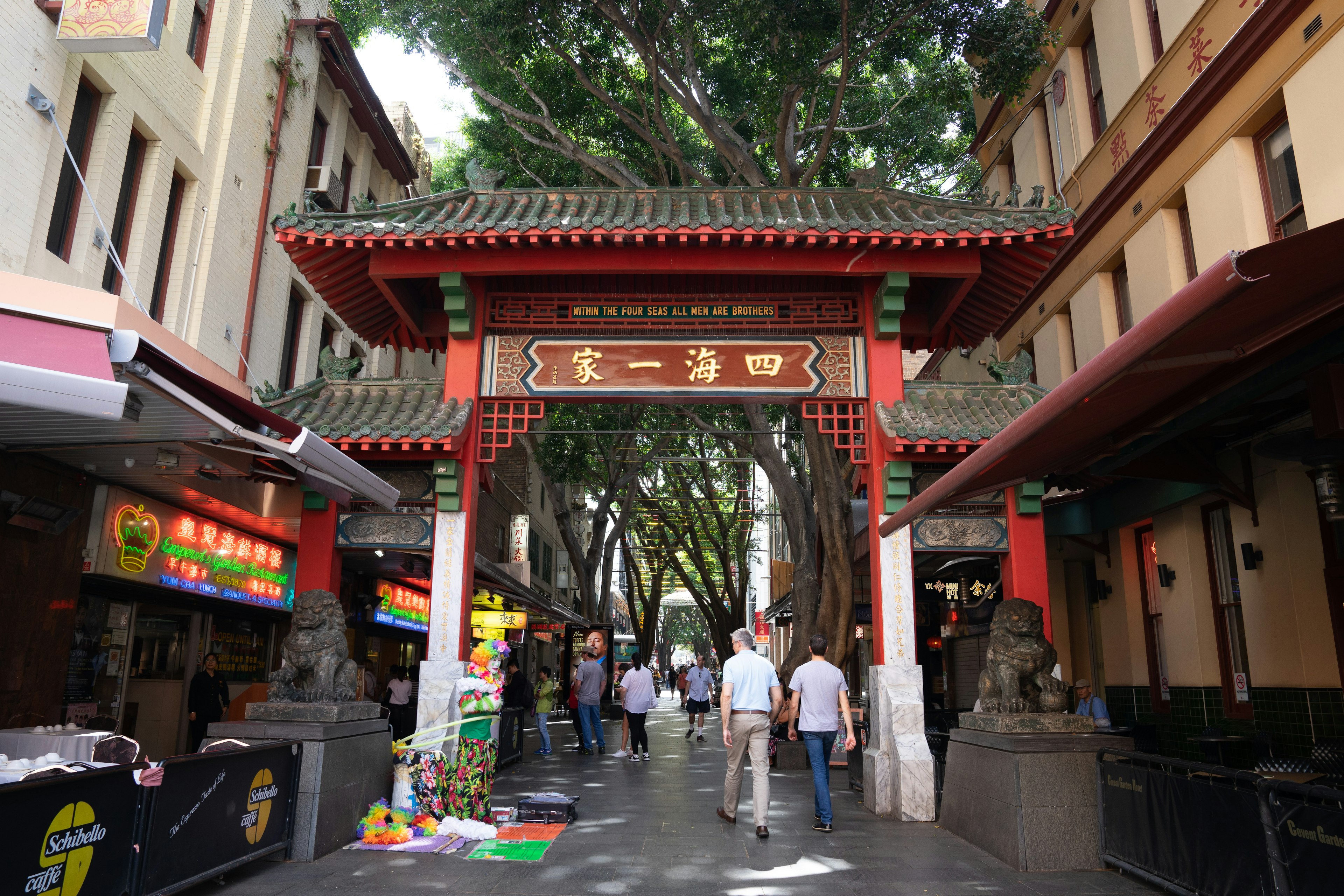 People walking through The arch gate of china town (Paifang) on Dixon  in Sydney,