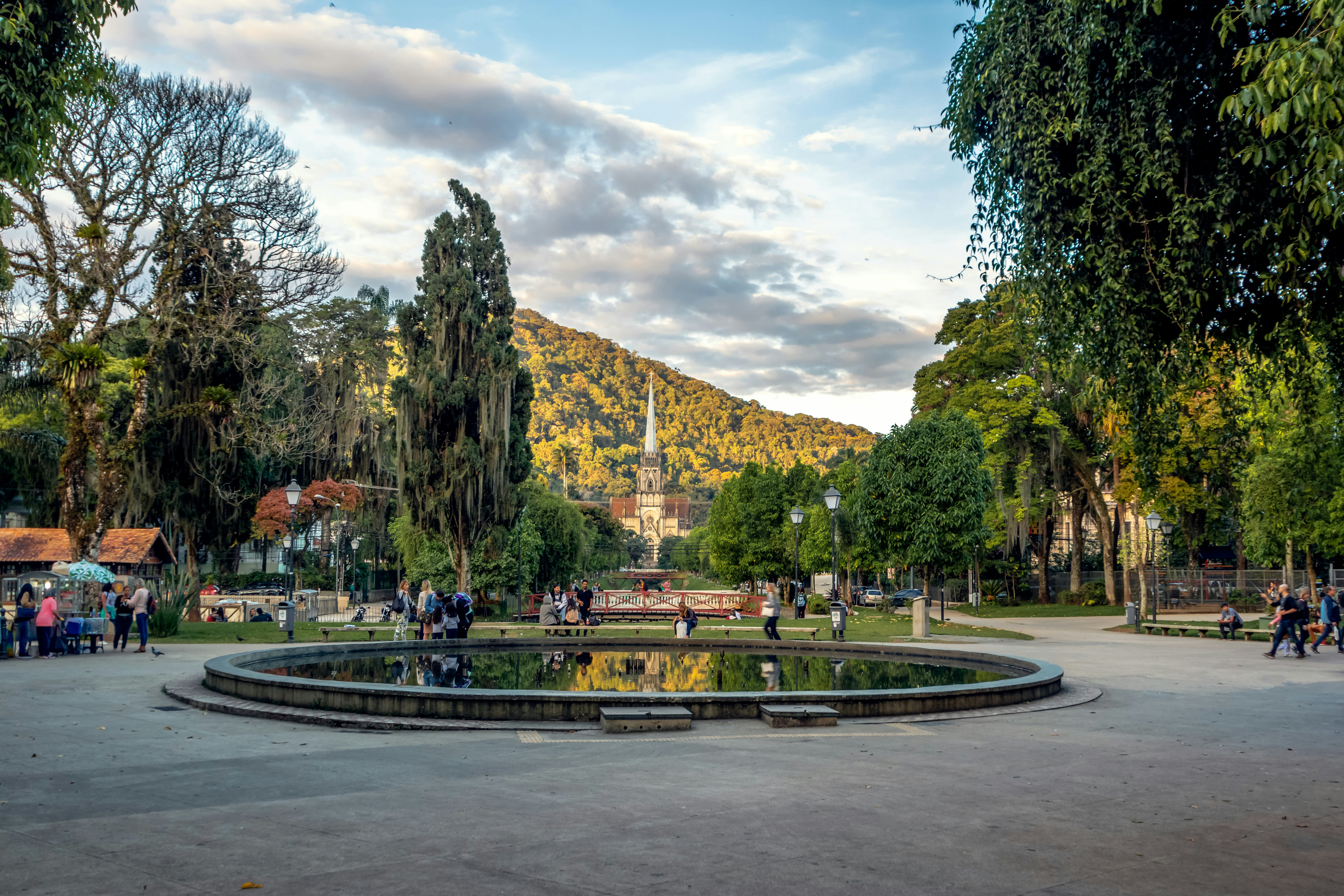 People walk around Praca da Liberdade Square in Petrópolis, Brazil