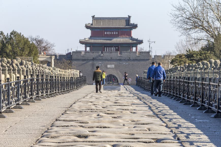 People in front of Wanping Fortress, a Ming Dynasty walled city in Beijing