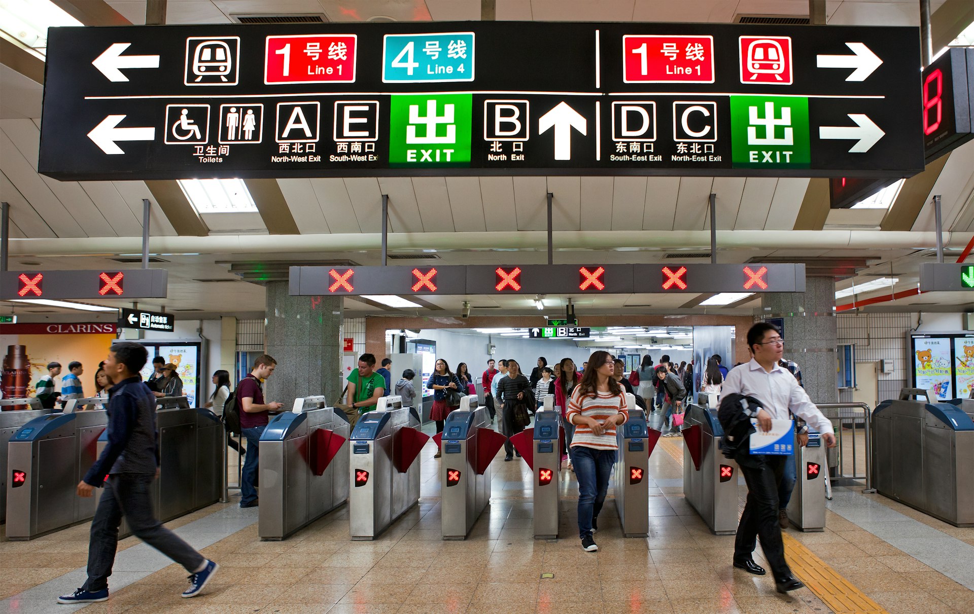 Passengers at a Beijing subway station