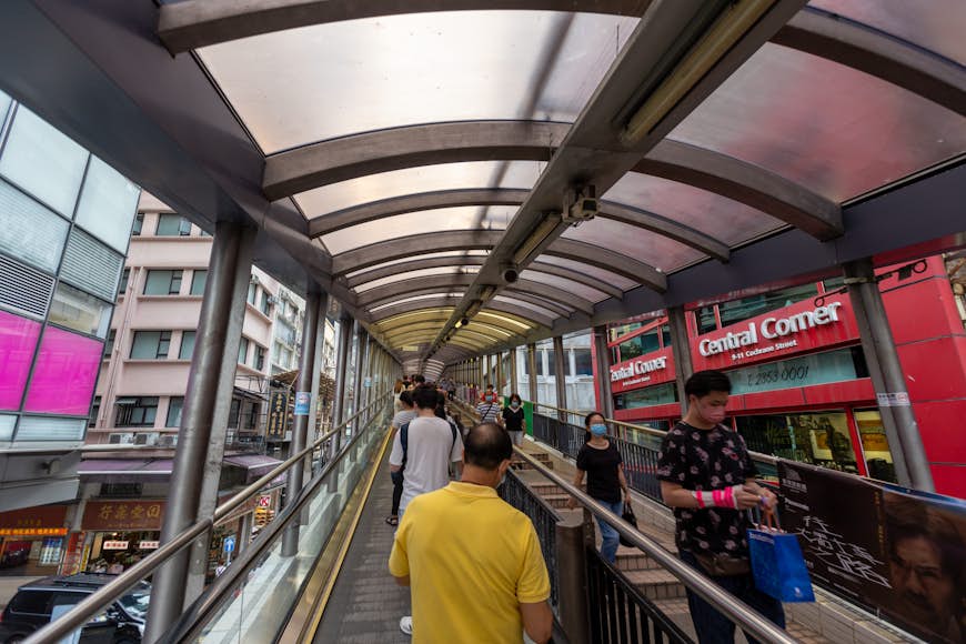 People at the Central - Mid-Levels escalator and walkway system in Hong Kong, the longest outdoor covered escalator system in the world