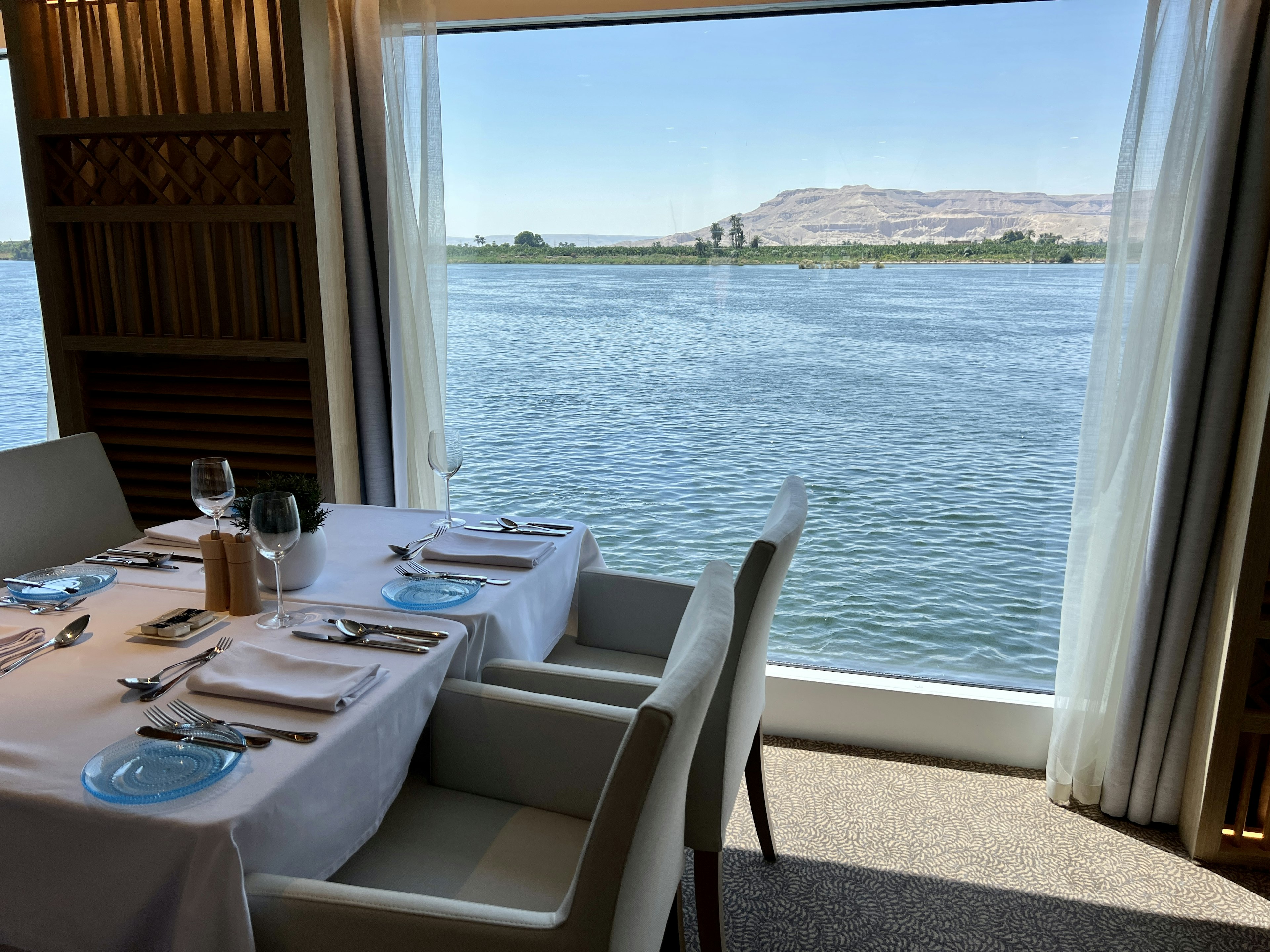 A view from within a small cruise ship out onto the Nile River in Egypt