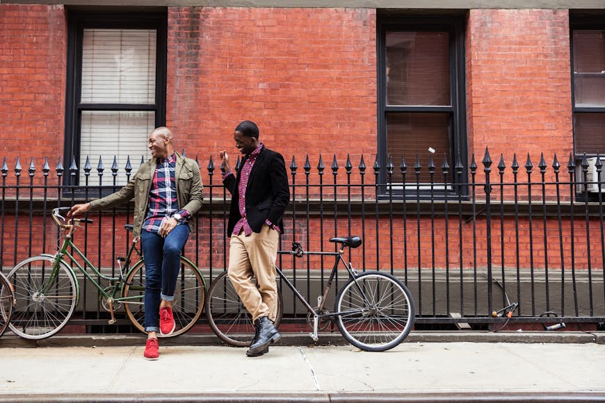 A couple relax with bikes in Greenwich Village, NYC