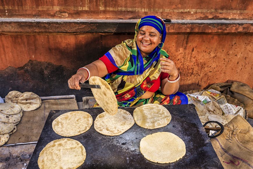 Indian street vendor preparing food - chapatti, flat bread, Jaipur - The Pink City, Rajasthan, India.  