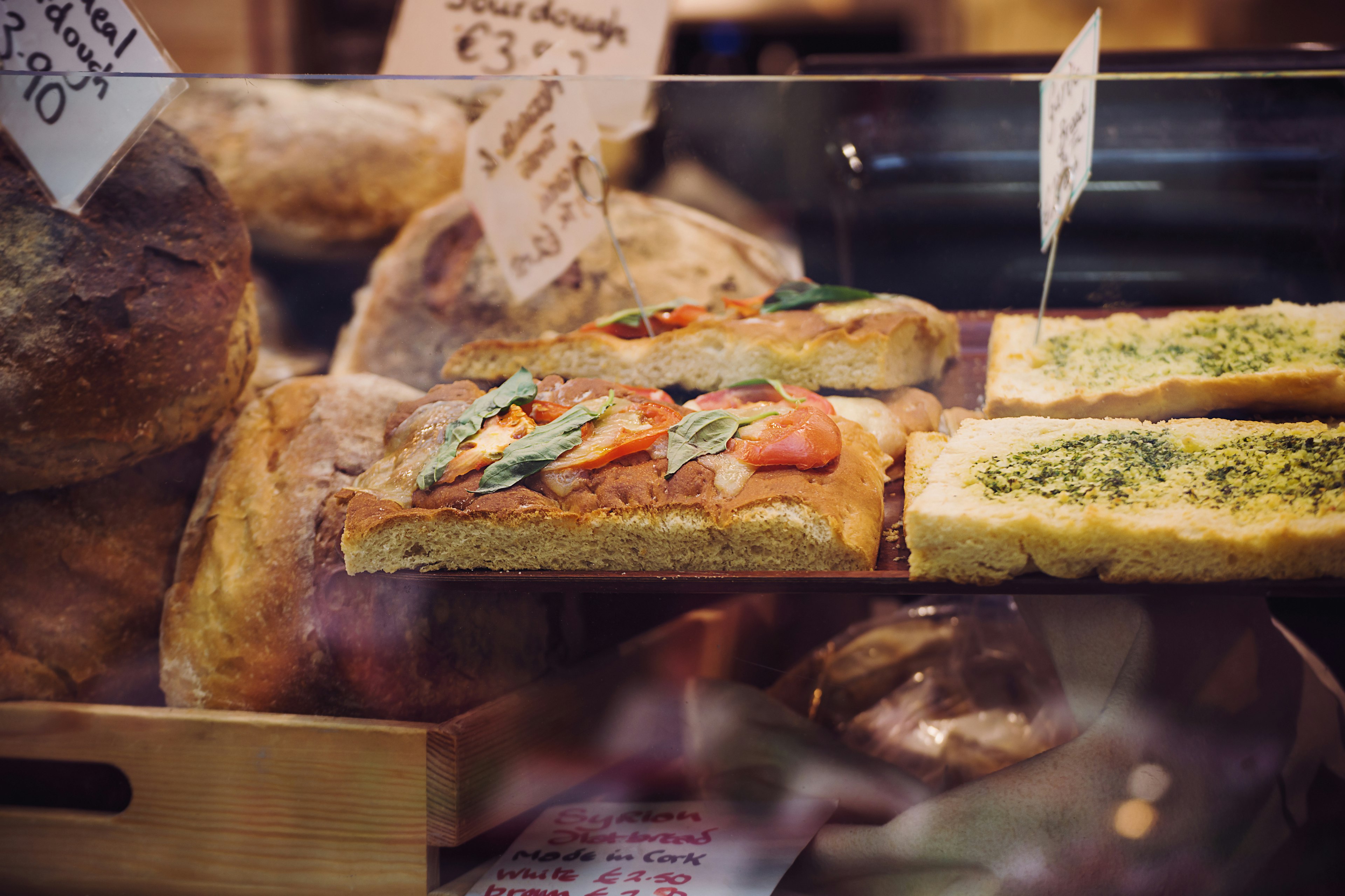 English Market stand selling bread and seasoned flat bread in Cork, Ireland