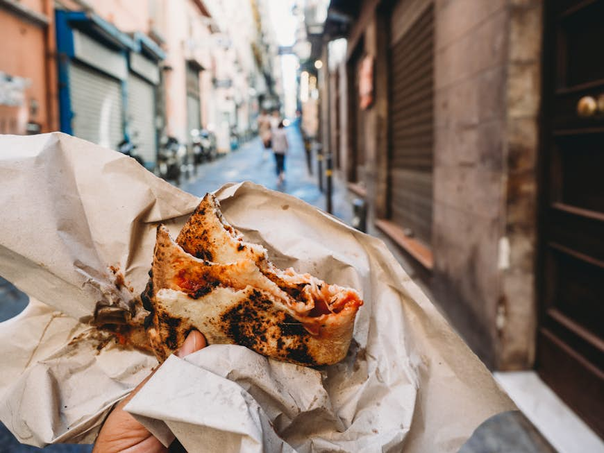 Pov view of a man eating a typical 