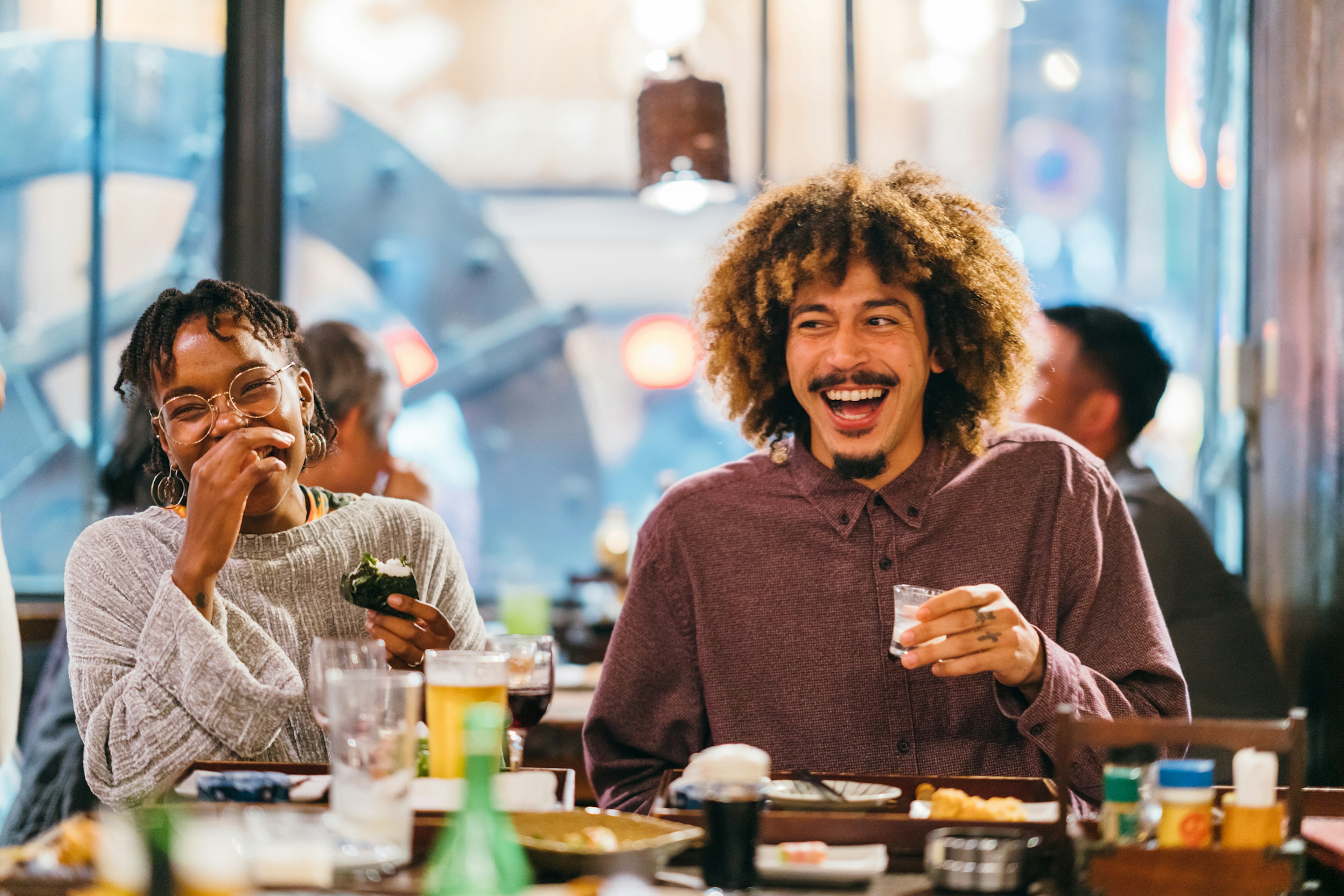 A group of friends enjoying at Japanese pub