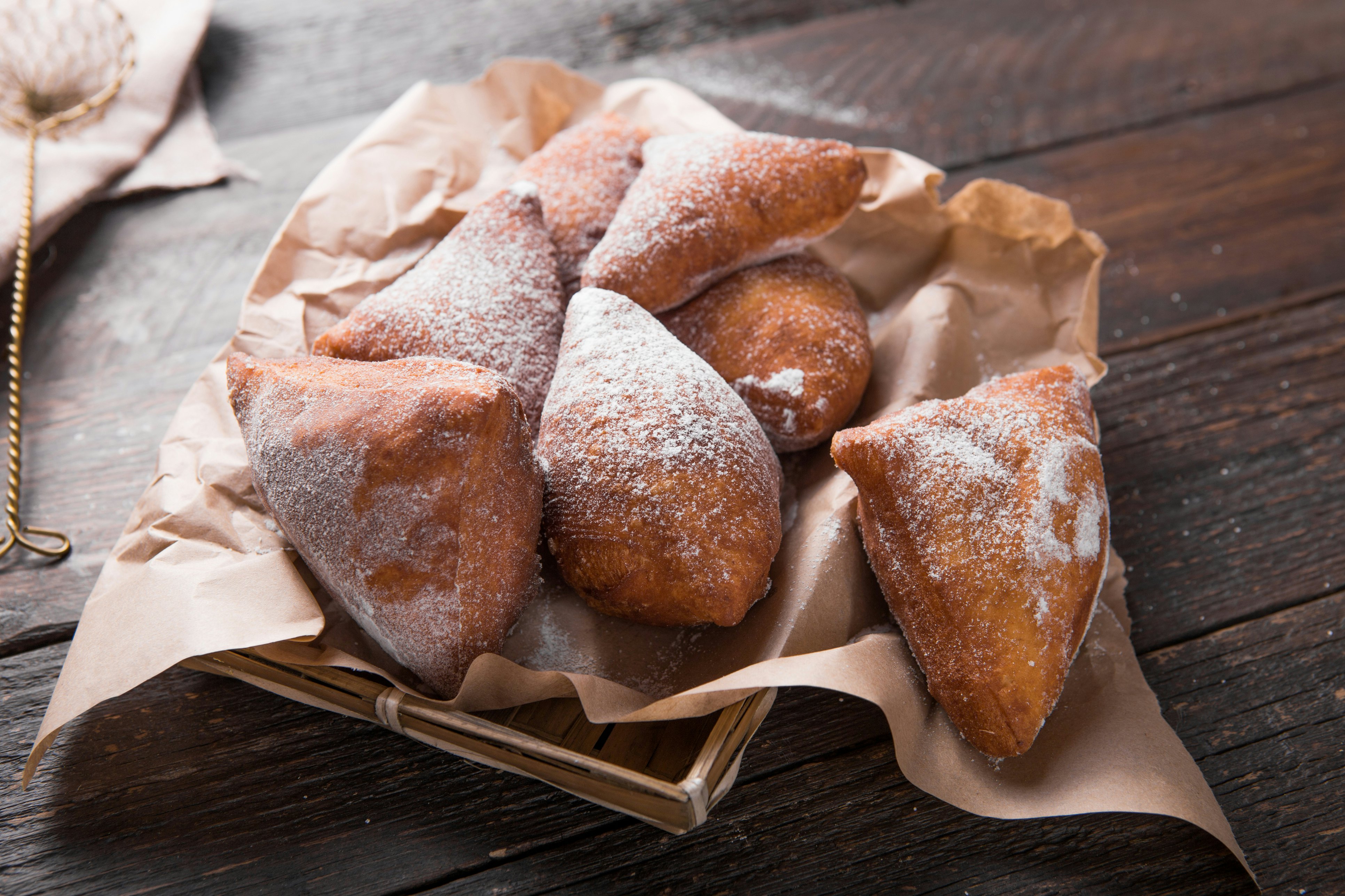 top view from above of a platter of mandazi, which is a triangular doughnut